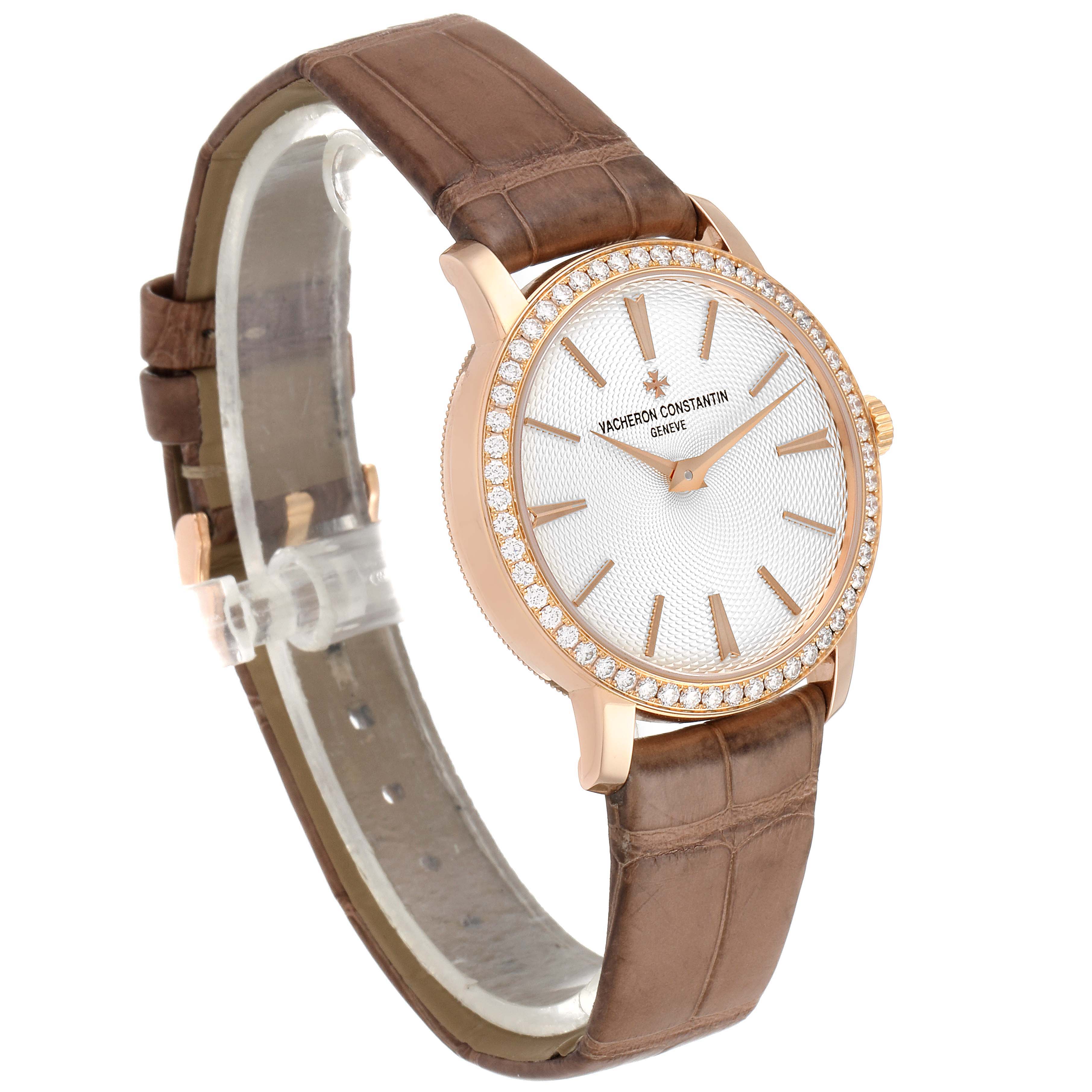 The Vacheron Constantin Traditionnelle 81590/000R-9847 Women's Rose Gold Silver Dial 81590/000R-9847 Women's Rose Gold Silver Dial watch is shown at a slight angle, displaying its face, strap, and diamond bezel.