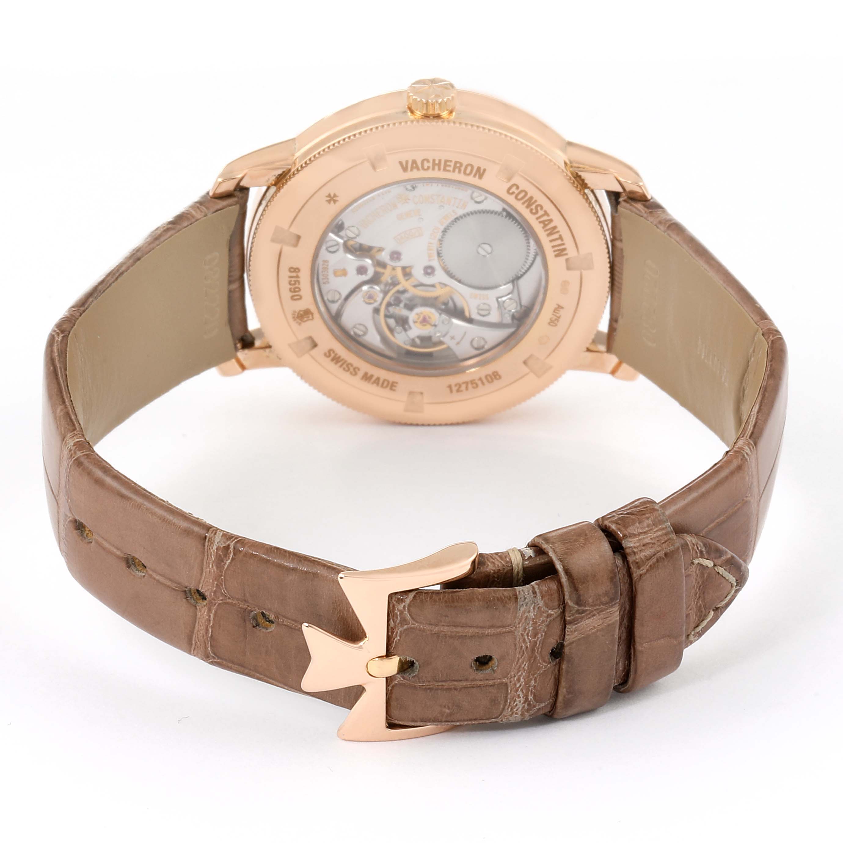 The image shows the back view of the Traditionnelle model by Vacheron Constantin, highlighting the case back and brown leather strap with a rose gold buckle.