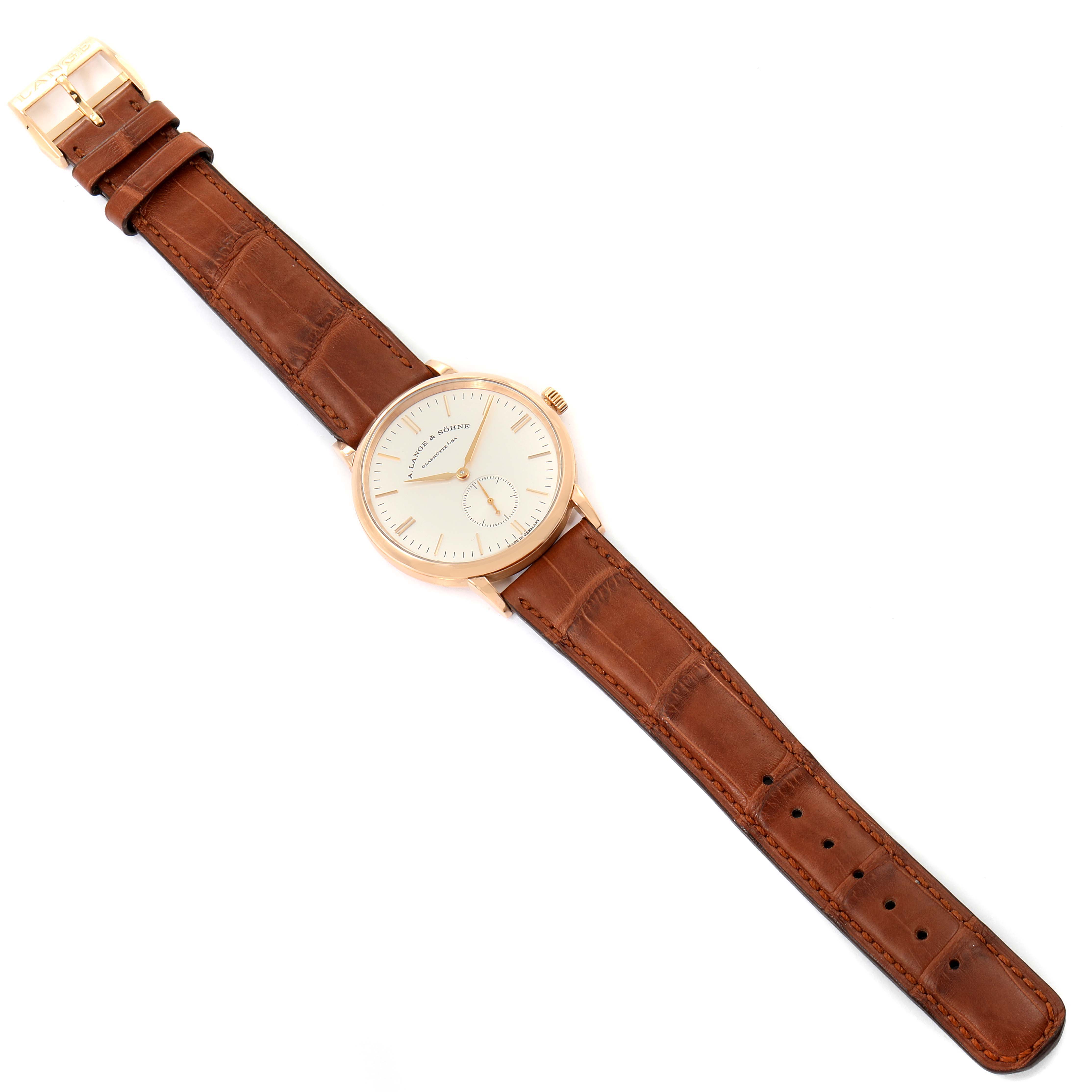 The image shows a top-down view of the A. Lange & Sohne Saxonia 219.032 Men's Rose Gold Silver Dial watch with a brown leather strap and gold casing.