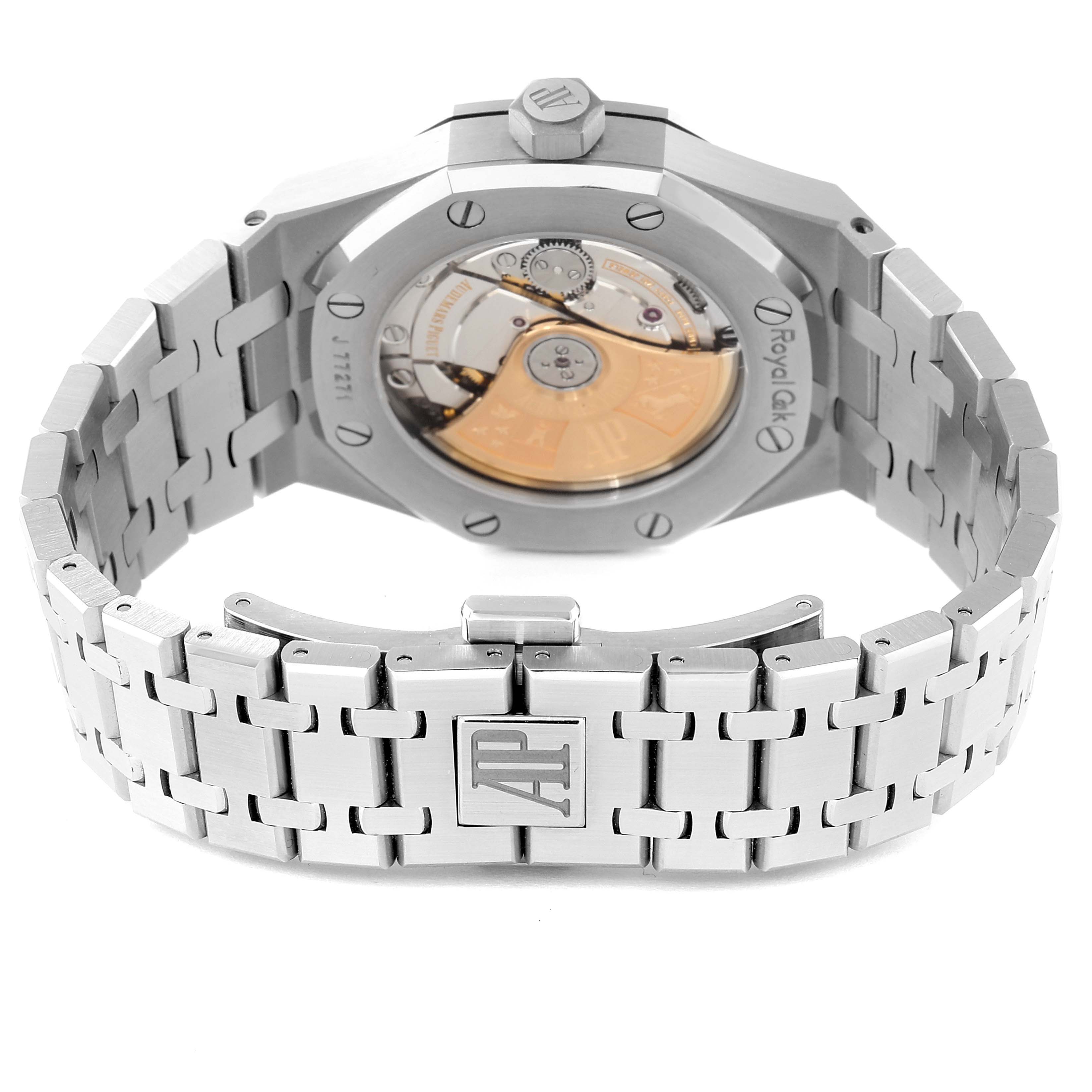 The image shows the back view of an Audemars Piguet Royal Oak 15450ST.OO.1256ST.01 Men
s Stainless Steel Silver Dial 15450ST.OO.1256ST.01 Men
s Stainless Steel Silver Dial watch, highlighting the automatic movement and metal bracelet.