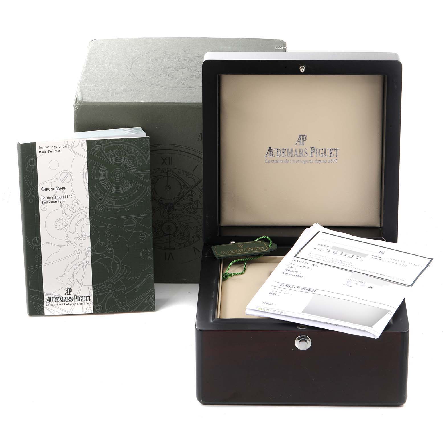 The image shows the Audemars Piguet Royal Oak Offshore 25721TI.O.1000TI.01 Men's Titanium Grey Dial 25721TI.O.1000TI.01 Men's Titanium Grey Dial watch's box, pamphlets, and documentation from a front angle.