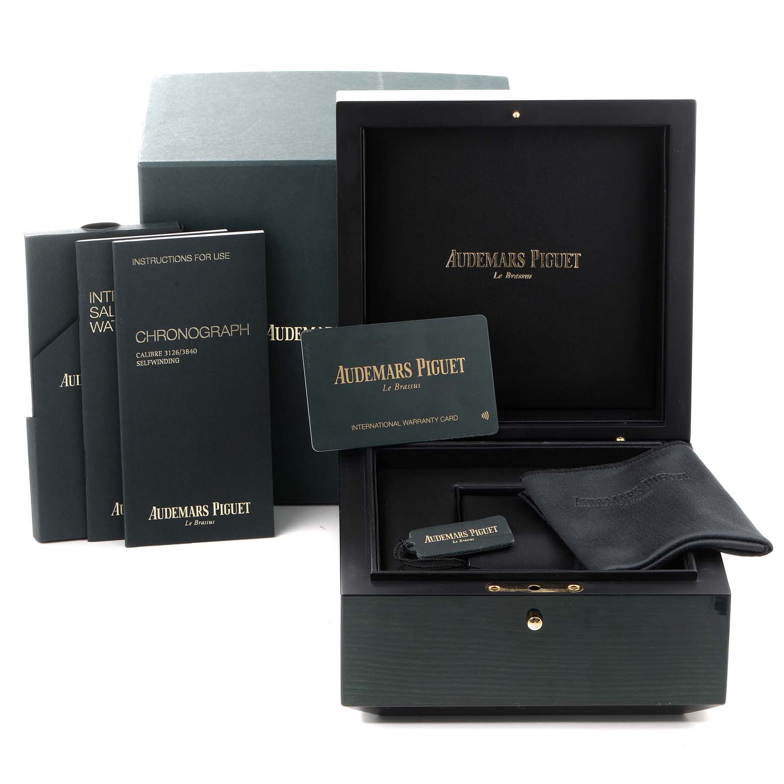 The image shows the packaging and accessories for the Royal Oak Offshore by Audemars Piguet, including the box, warranty card, and booklets.