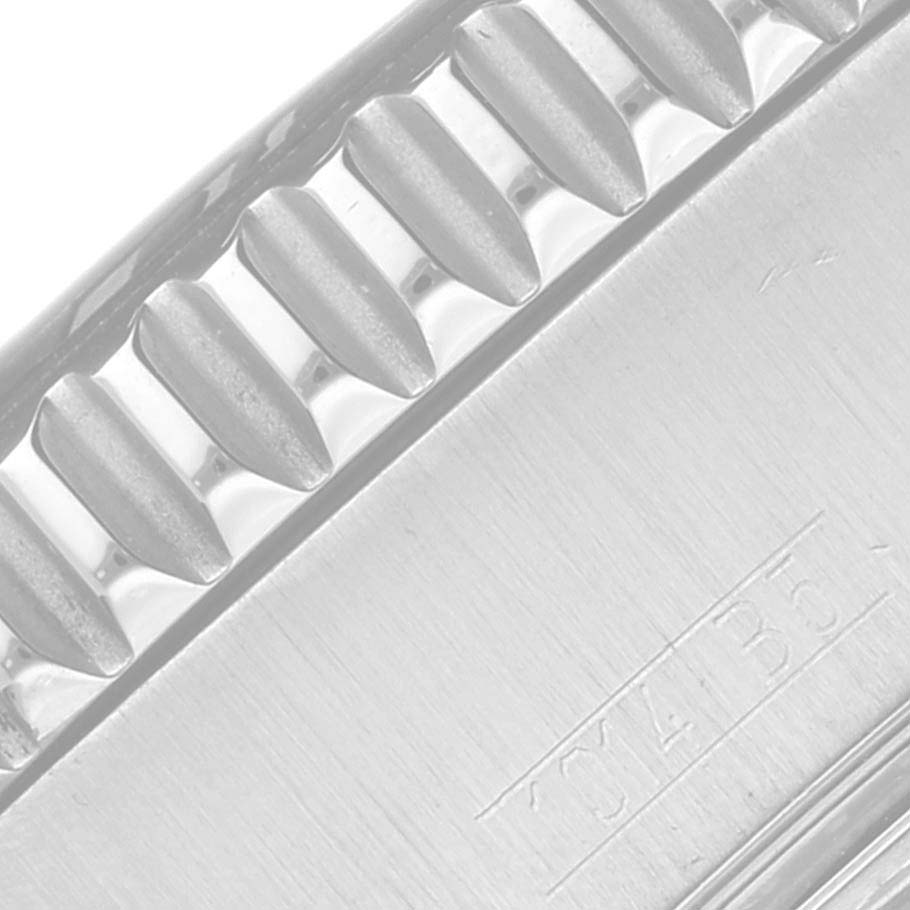 The image shows a close-up of the bezel and a part of the case of a Breitling Superocean A17391 Men's Stainless Steel Black Dial A17391 Men's Stainless Steel Black Dial watch.