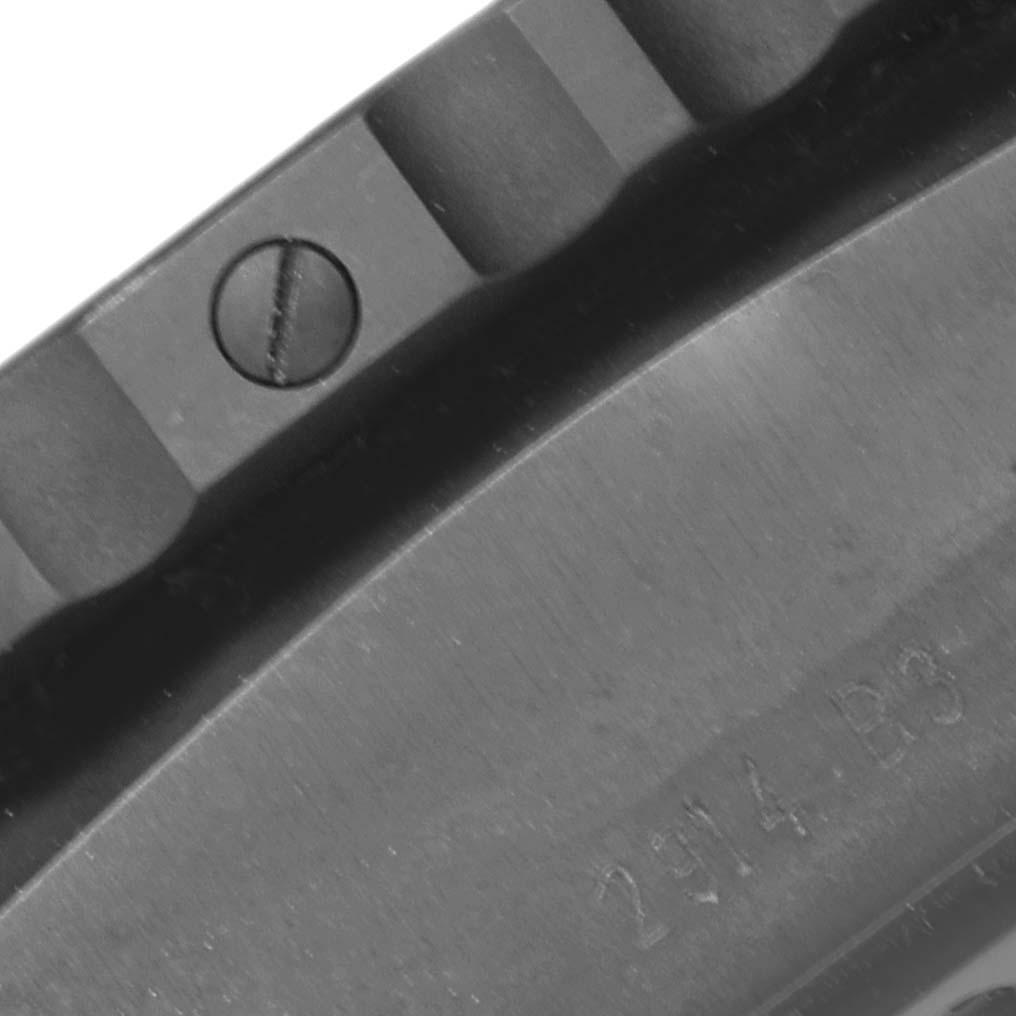 The image shows a macro close-up of the bezel and part of the engraved back of a Breitling Professional Series VB501022/BD41 Men's Titanium Black Dial VB501022/BD41 Men's Titanium Black Dial watch.