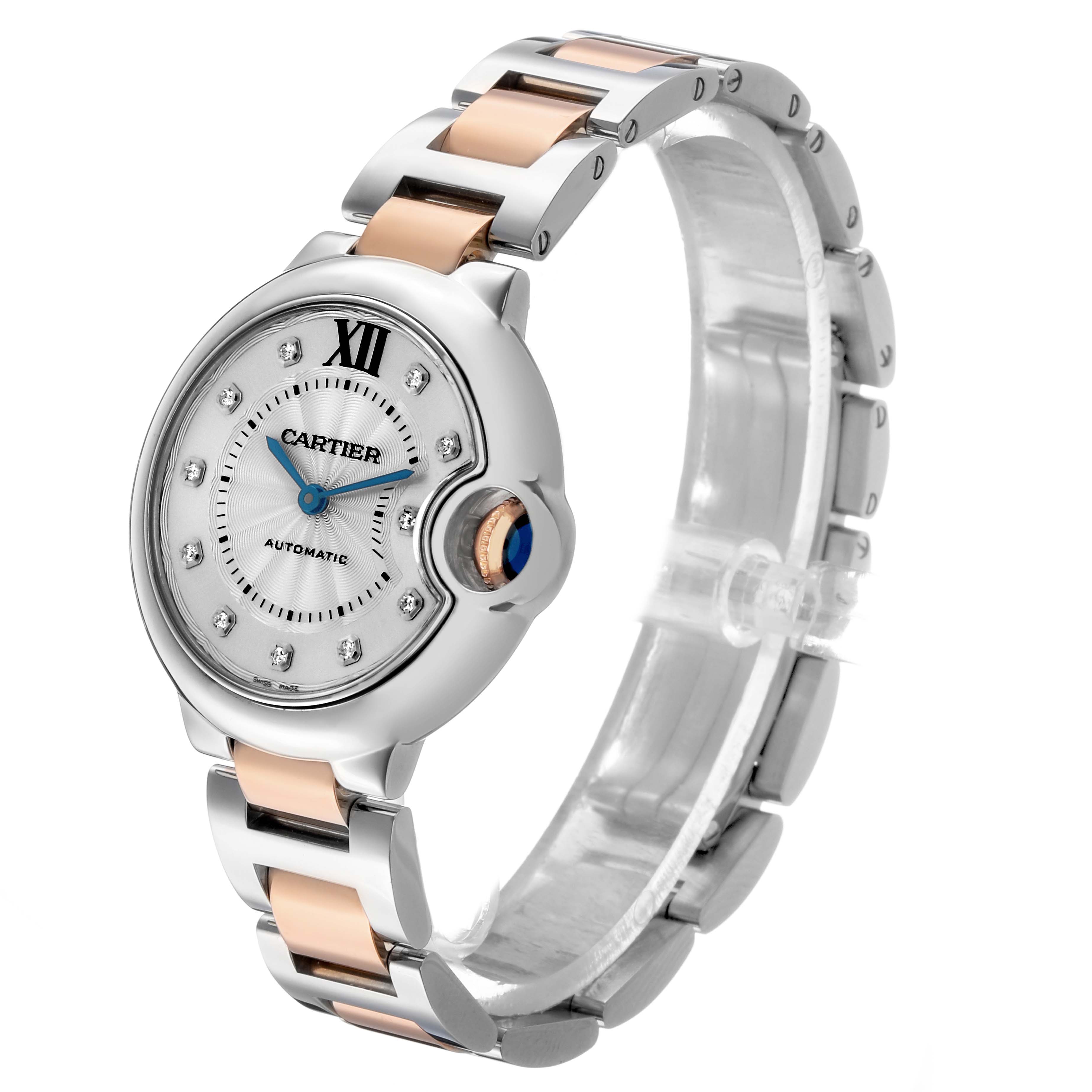 The image shows a Cartier Ballon Bleu WE902044 Women's Steel and Gold (two tone) Silver Dial watch from a three-quarter angle, highlighting its face, crown, and bracelet.