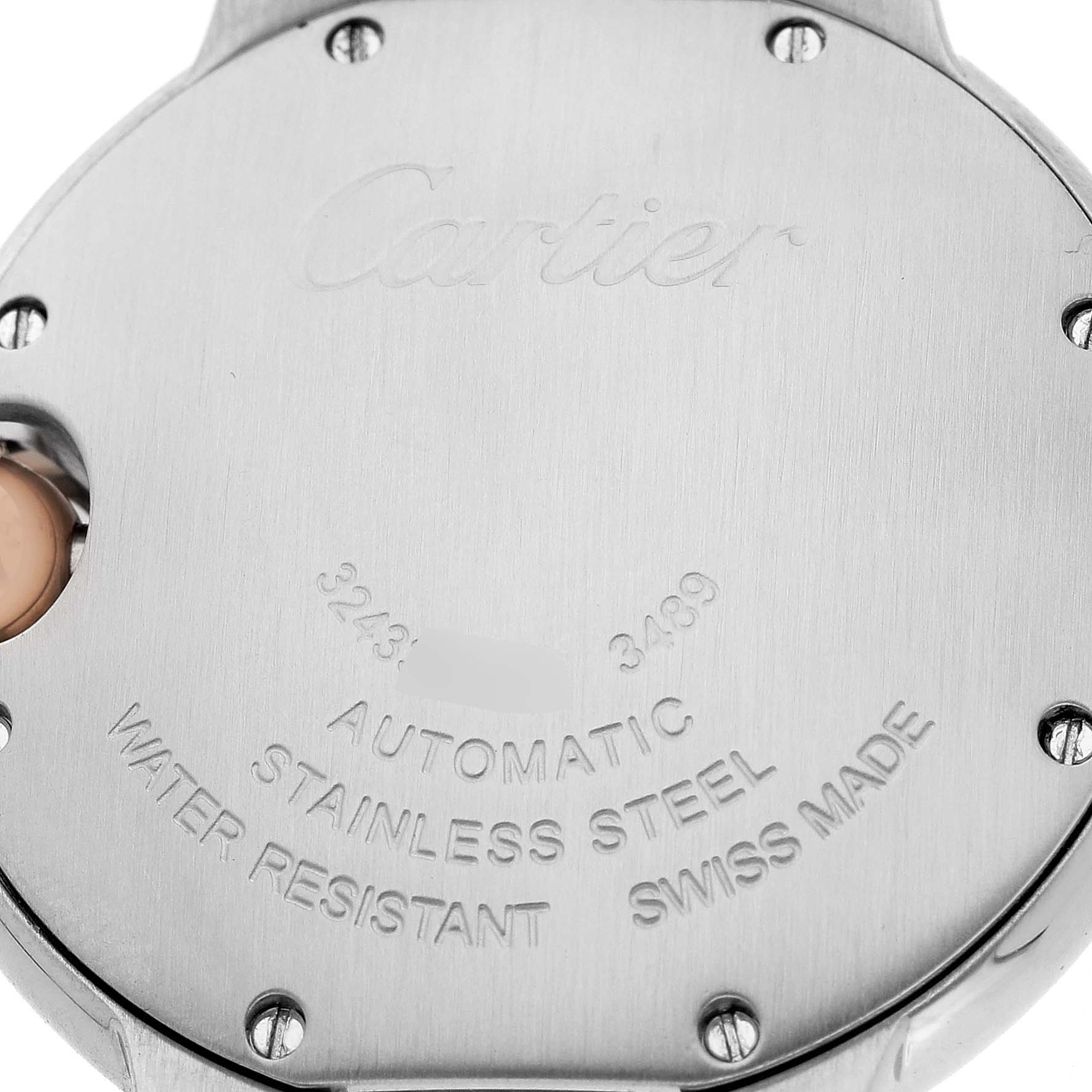 The image shows the back case of a Cartier Ballon Bleu WE902044 Women's Steel and Gold (two tone) Silver Dial watch, highlighting engraved text and screws.
