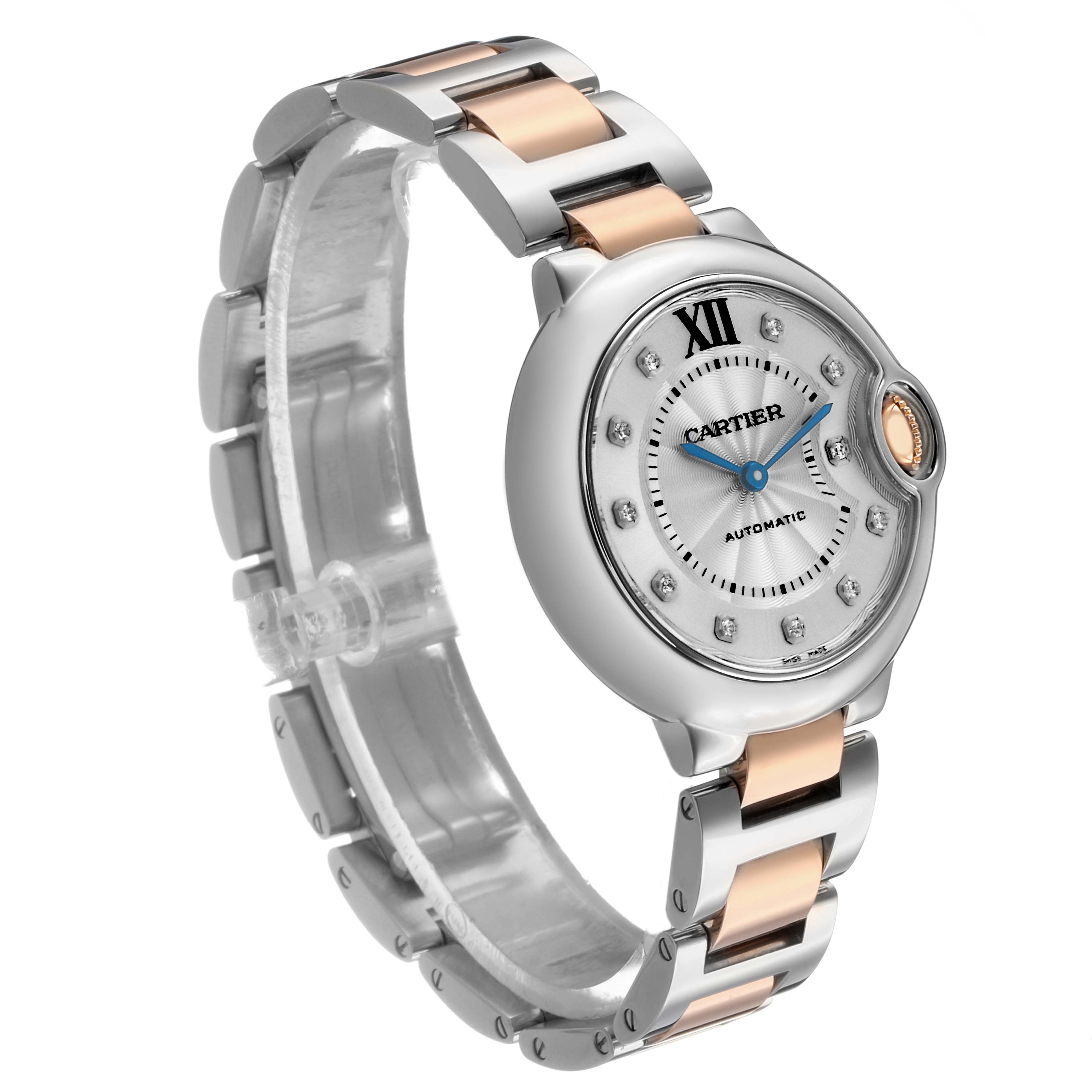 The image shows a Cartier Ballon Bleu WE902044 Women's Steel and Gold (two tone) Silver Dial watch at an angle highlighting the face, crown, and metal bracelet.