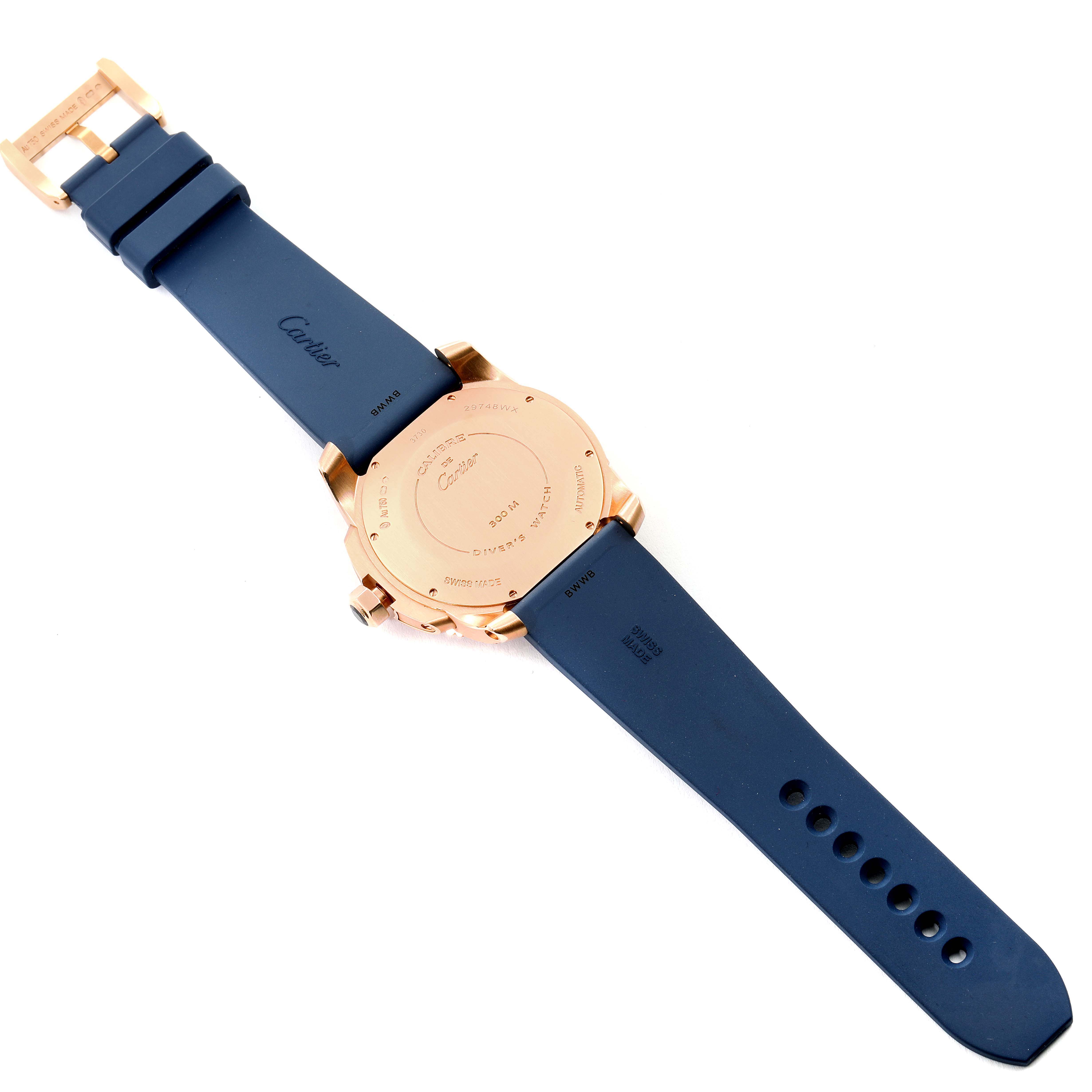 The image shows the backside of a Calibre de Cartier watch by Cartier, highlighting the back case and blue strap.