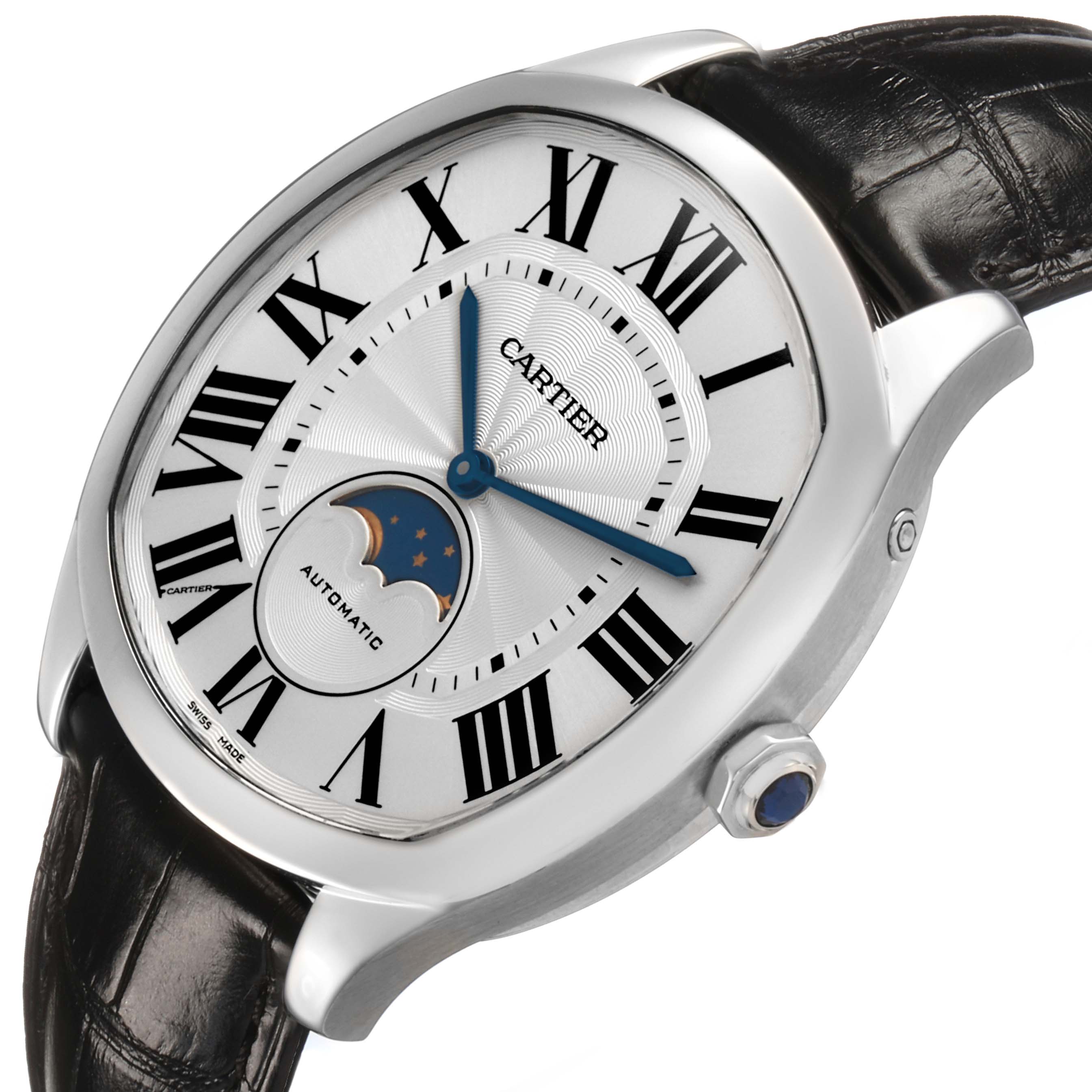 The Drive de Cartier watch is shown at an angled top view, highlighting the dial, Roman numerals, moon phase, and crown detail.