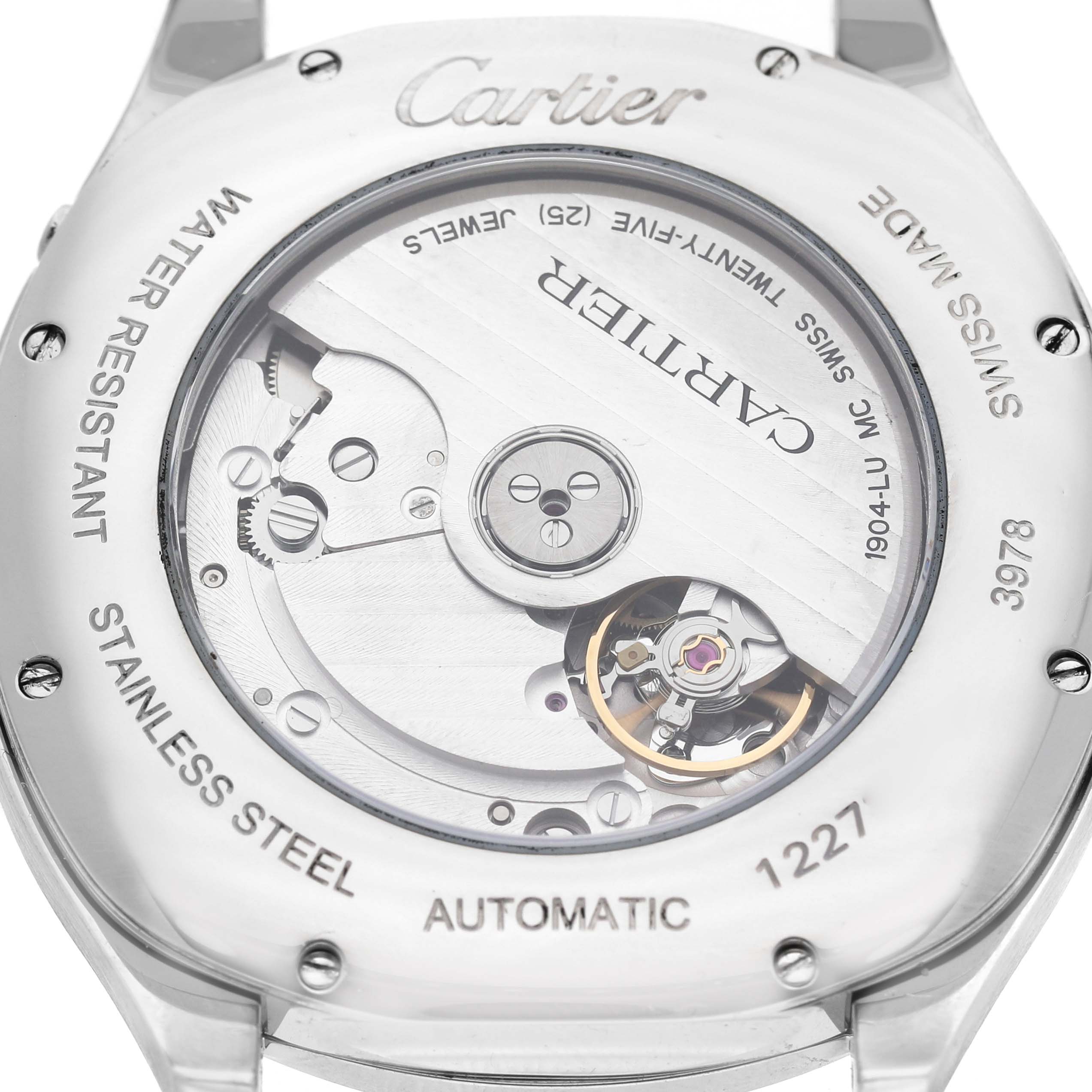 The image shows the back view of the Drive de Cartier watch, highlighting its automatic movement and stainless steel casing.