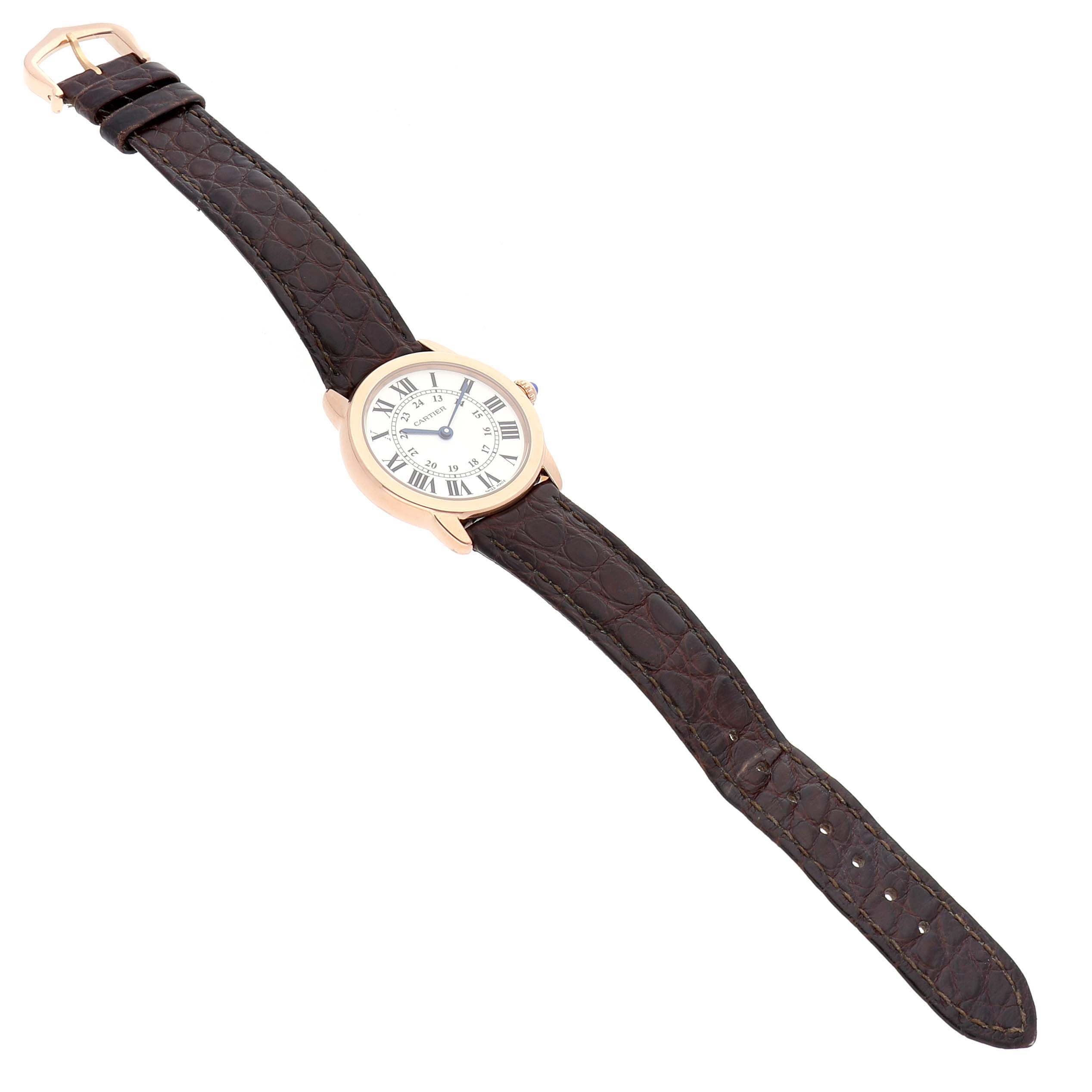 The Cartier Ronde W6701007 Women's Rose Gold Silver Dial watch is shown from a top-down angle, featuring its entire face, case, and leather strap.