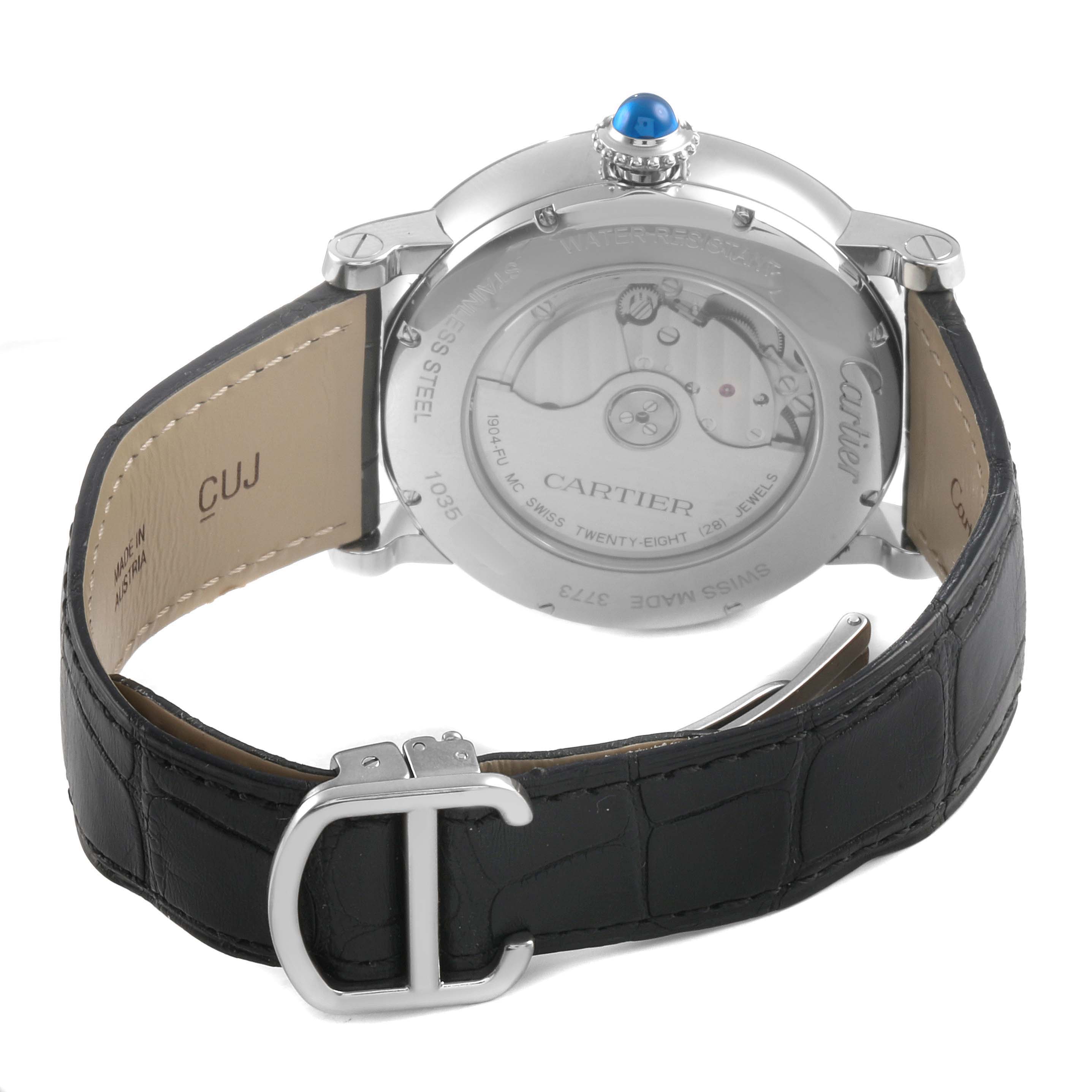 The image shows the back of a Rotonde de Cartier watch, highlighting the movement, crown, and leather strap.