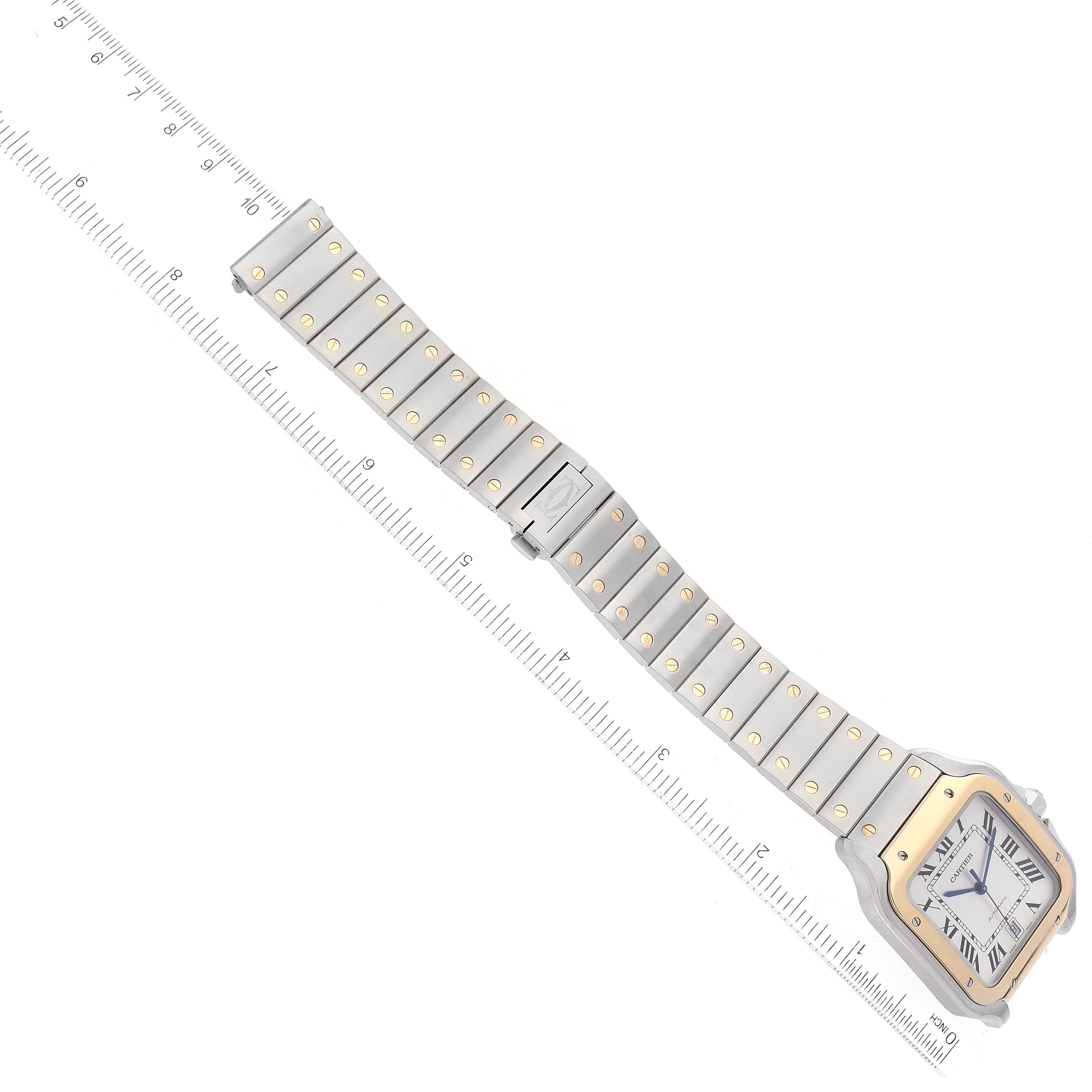 The image shows a top view of the Santos model watch by Cartier, displaying the case, dial, and bracelet with ruler for scale.