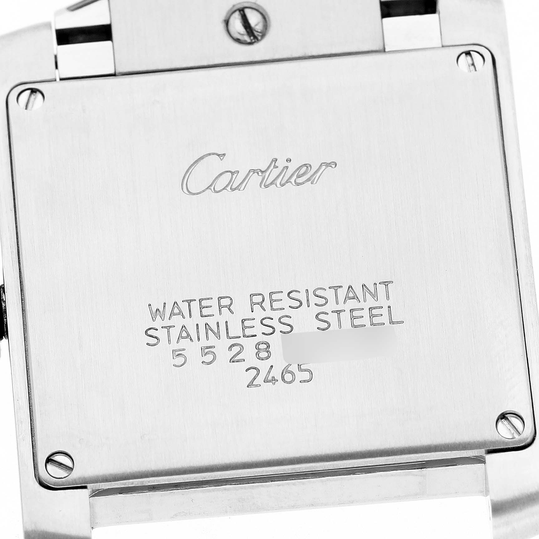 The image shows the back case of a Cartier Tank Française watch, highlighting its stainless steel and water resistance markings.
