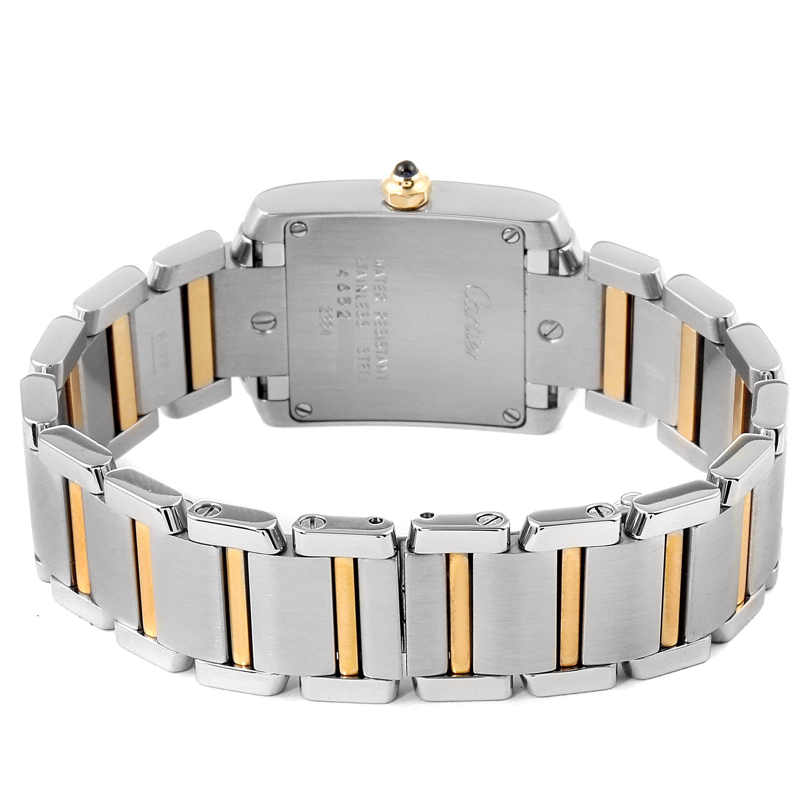 The image shows the back and bracelet of a Cartier Tank Française watch, highlighting its silver and gold links.