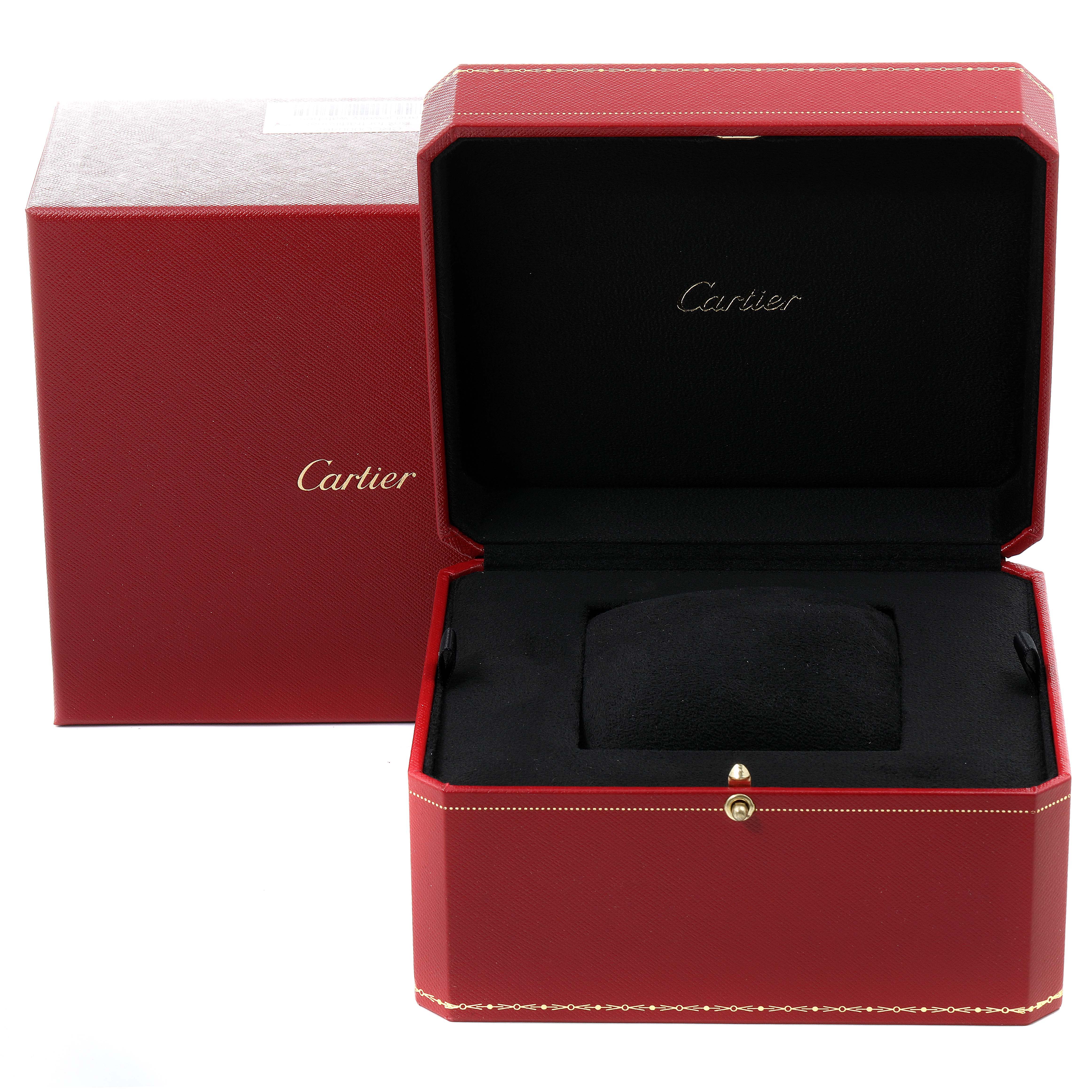 The image shows an open red Cartier box for the Tank Obus model watch, with its black interior visible.