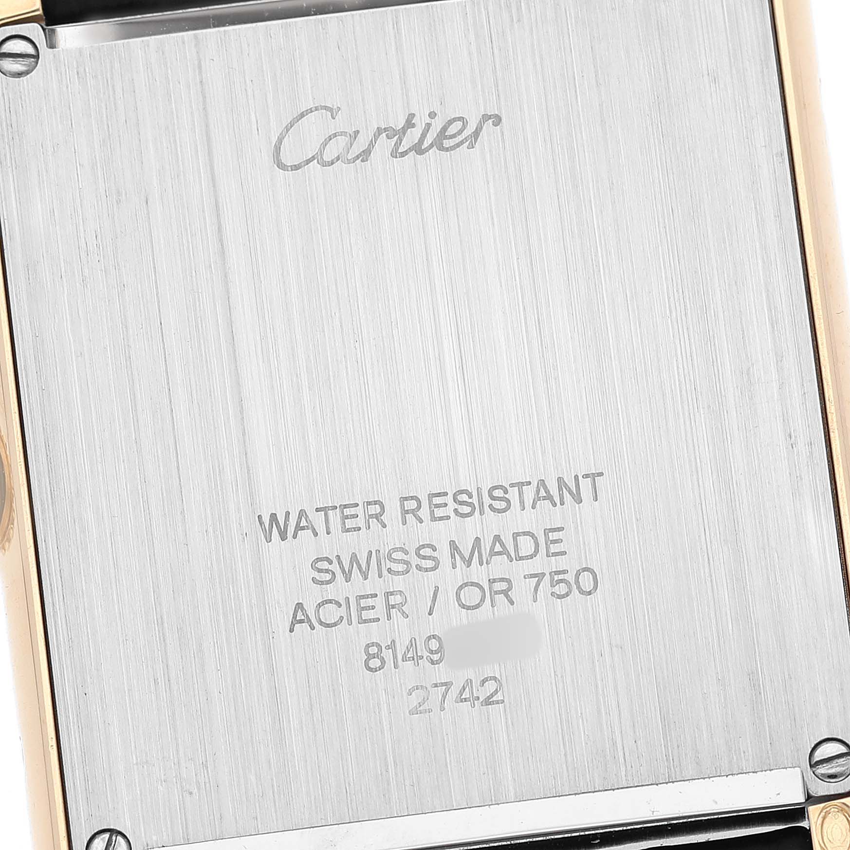 The image shows the back case of a Cartier Tank Solo W1018855 Men's Yellow Gold Silver Dial, displaying brand markings and details.