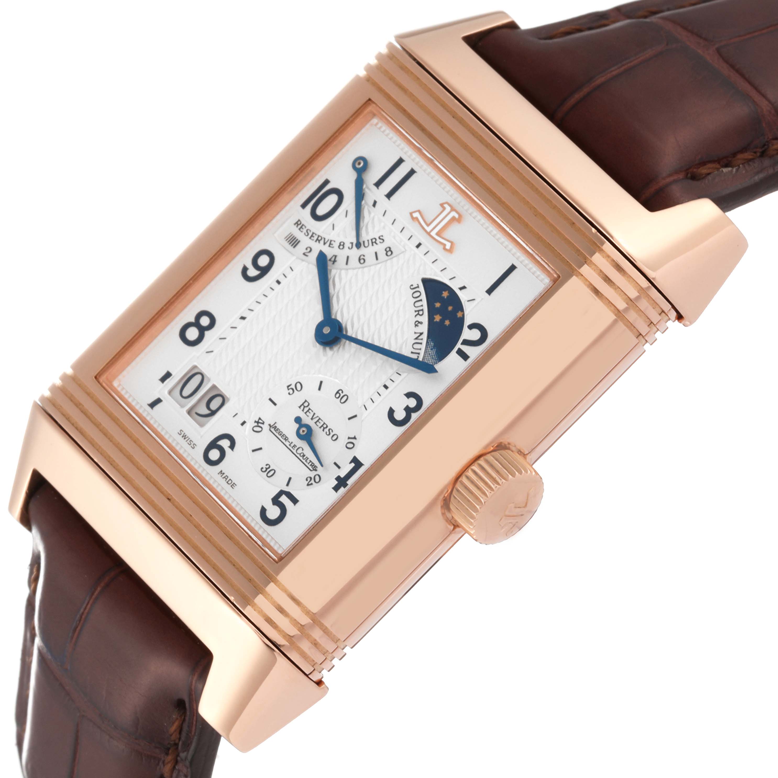 The image shows a close-up angle of a Jaeger LeCoultre Reverso Q3002420 Men's Rose Gold Silver Dial Q3002420 Men's Rose Gold Silver Dial watch, highlighting the dial, crown, and part of the brown leather strap.
