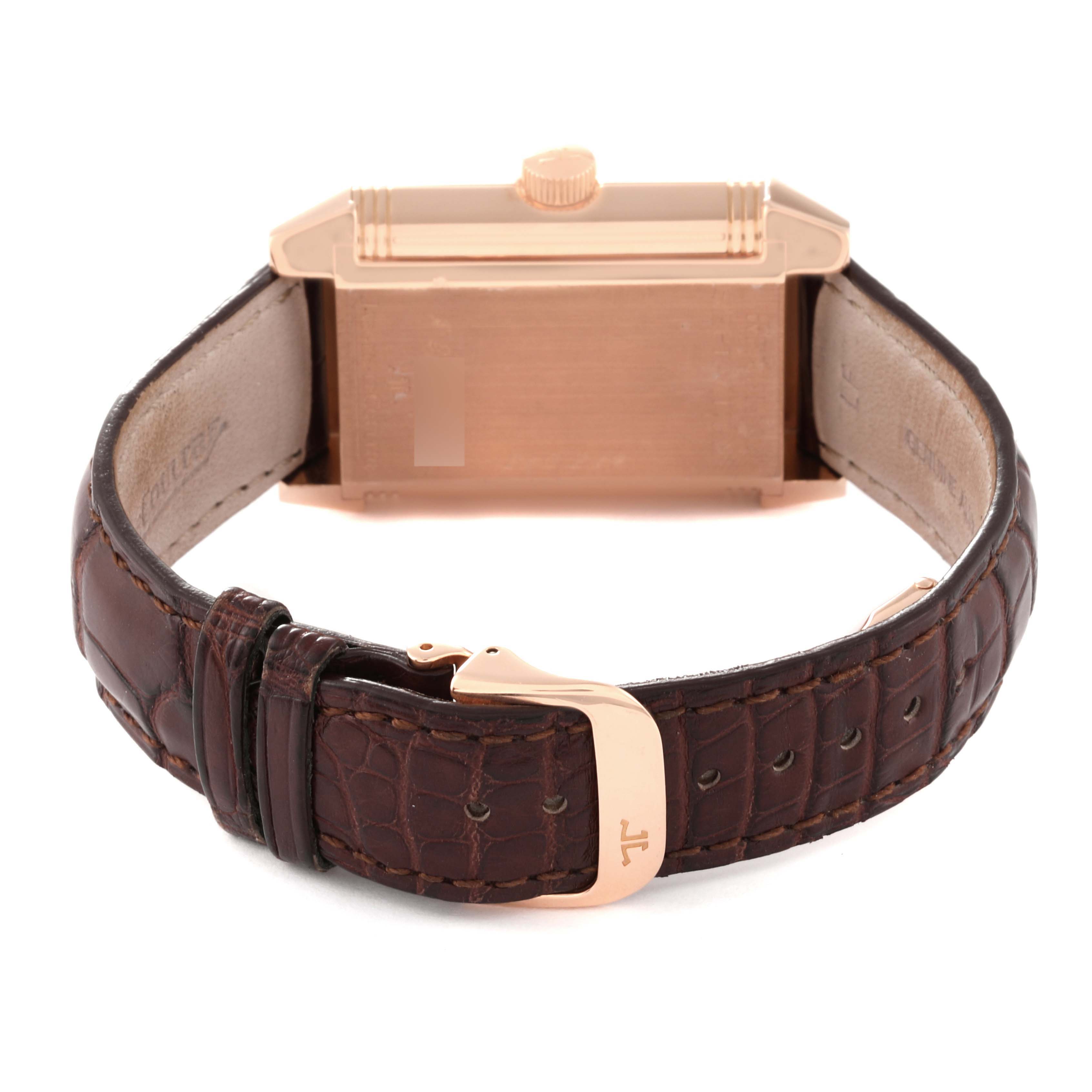 The image shows the back and clasp of a Jaeger LeCoultre Reverso Q3002420 Men's Rose Gold Silver Dial Q3002420 Men's Rose Gold Silver Dial watch, featuring a brown leather strap and gold-tone buckle.