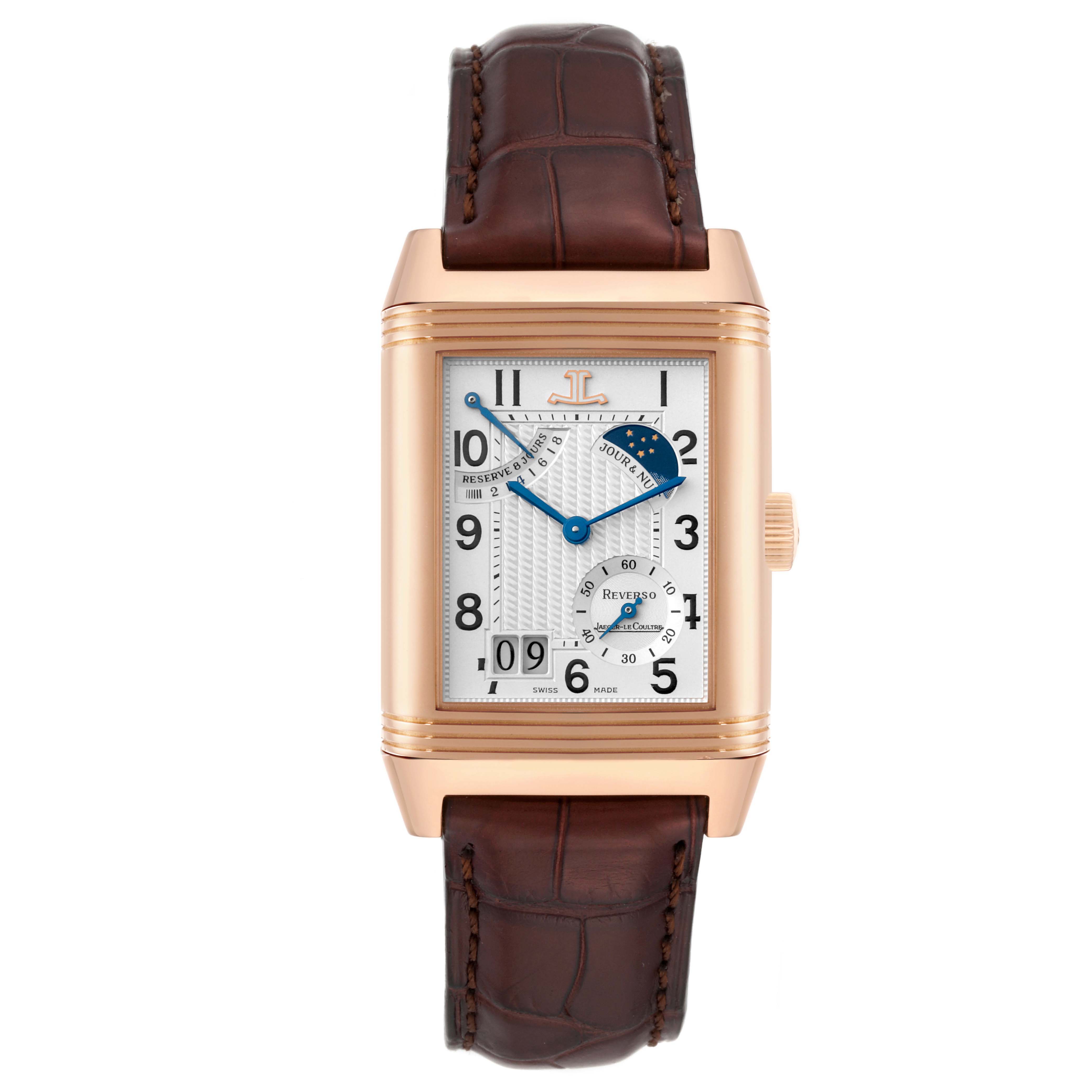 The Jaeger-LeCoultre Reverso watch is shown from a top-down angle, highlighting the face, case, and leather strap.