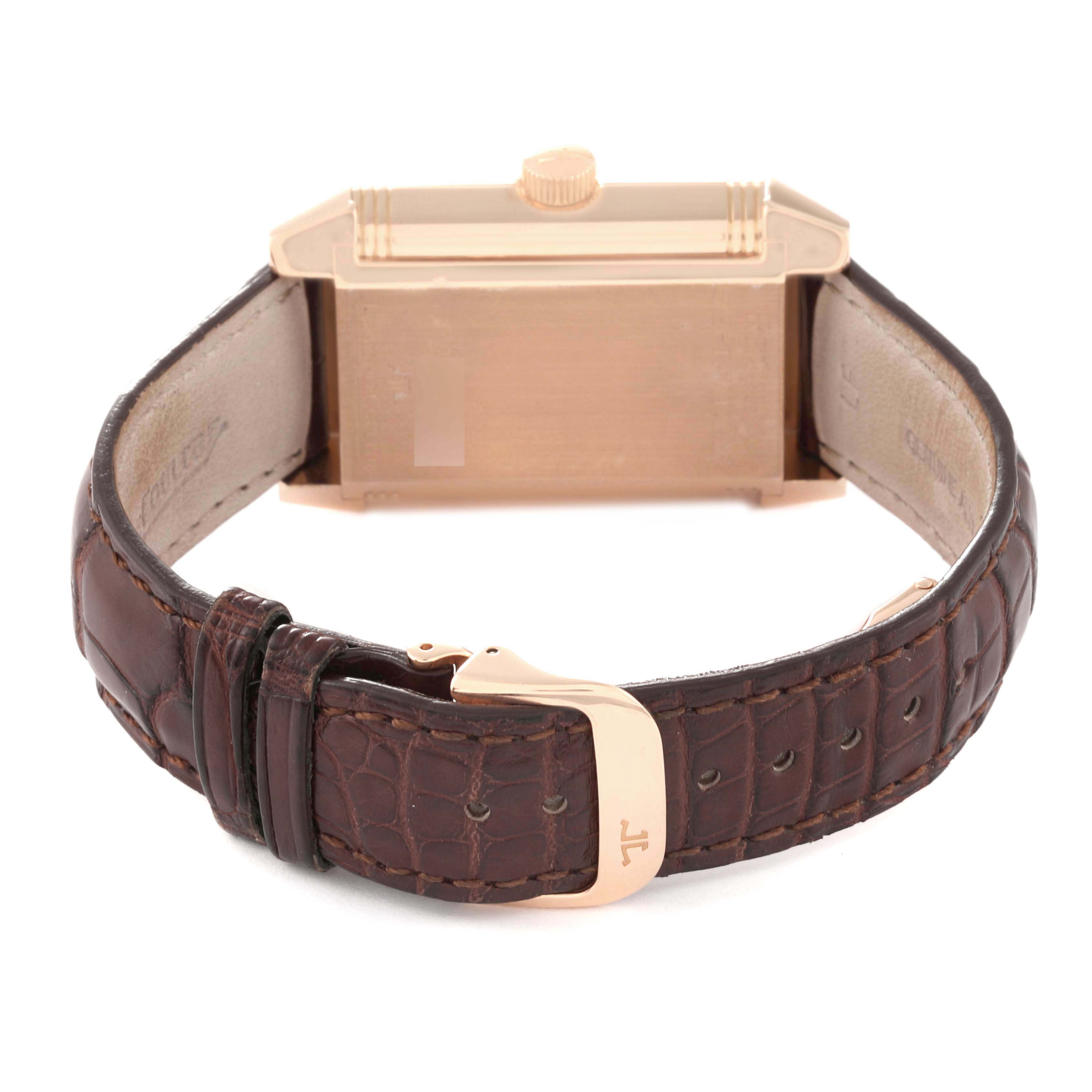 The Jaeger LeCoultre Reverso Q3002420 Men's Rose Gold Silver Dial watch is shown from the rear, highlighting the strap and clasp.