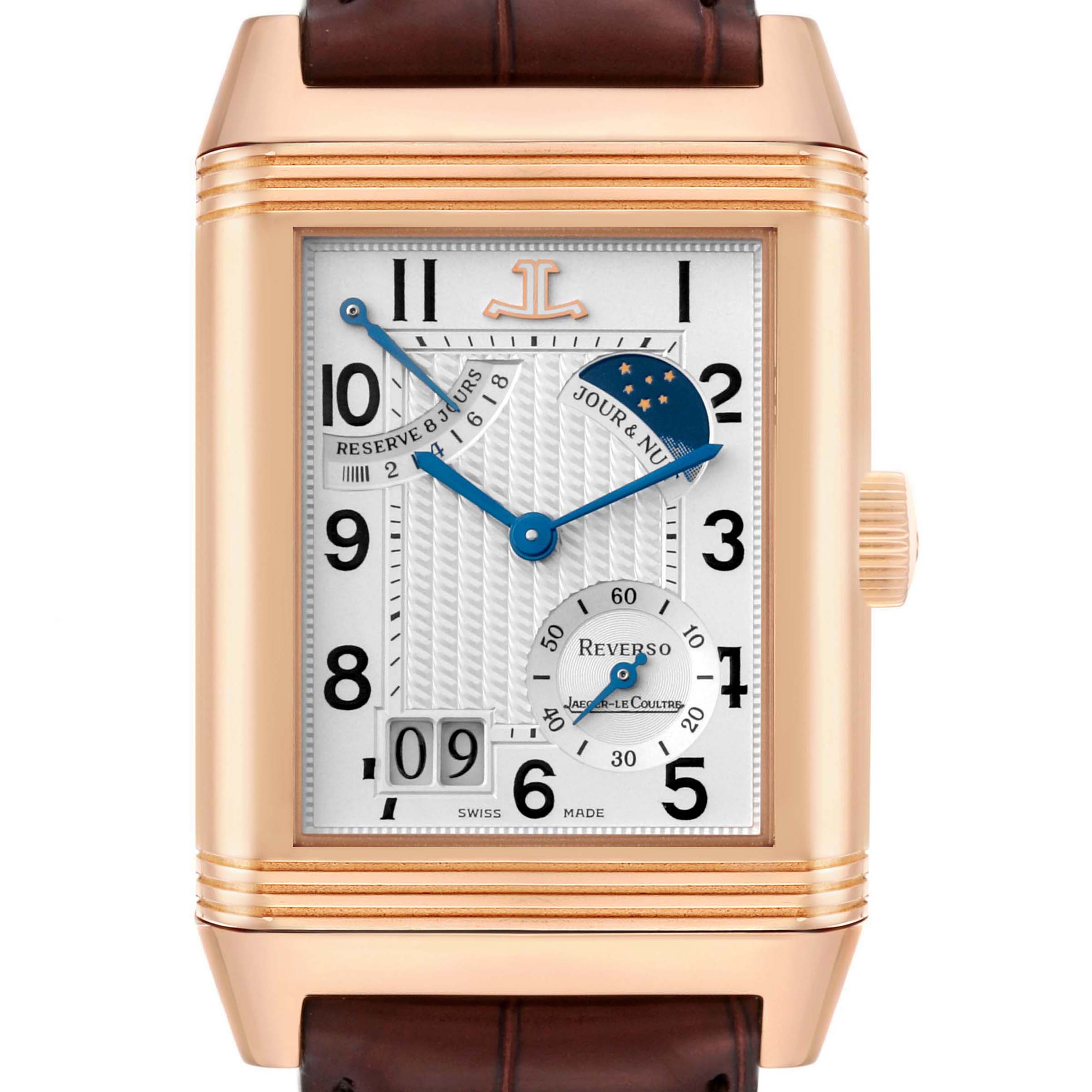 The Jaeger-LeCoultre Reverso watch is shown head-on, displaying its dial, crown, and leather strap.