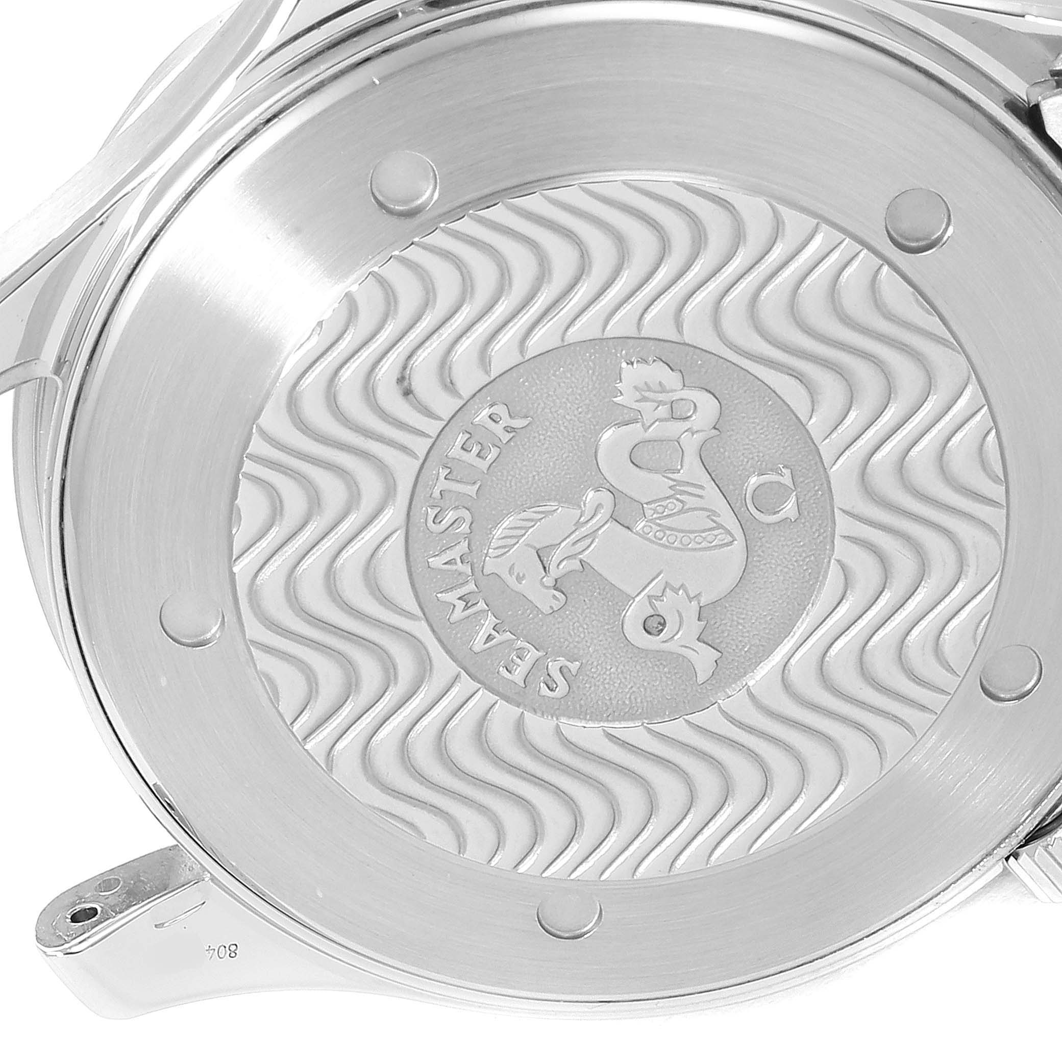 The image shows the case back of an Omega Seamaster 2230.50.00 Men
s Stainless Steel Black Dial 2230.50.00 Men
s Stainless Steel Black Dial watch, featuring the engraved logo and wavy pattern.