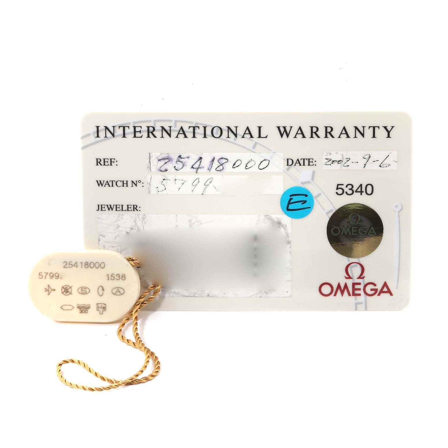 The image shows an Omega Seamaster 2541.80.00 Men
s Stainless Steel Blue Dial 2541.80.00 Men
s Stainless Steel Blue Dial model
s International Warranty card and a hangtag with reference number and other details.