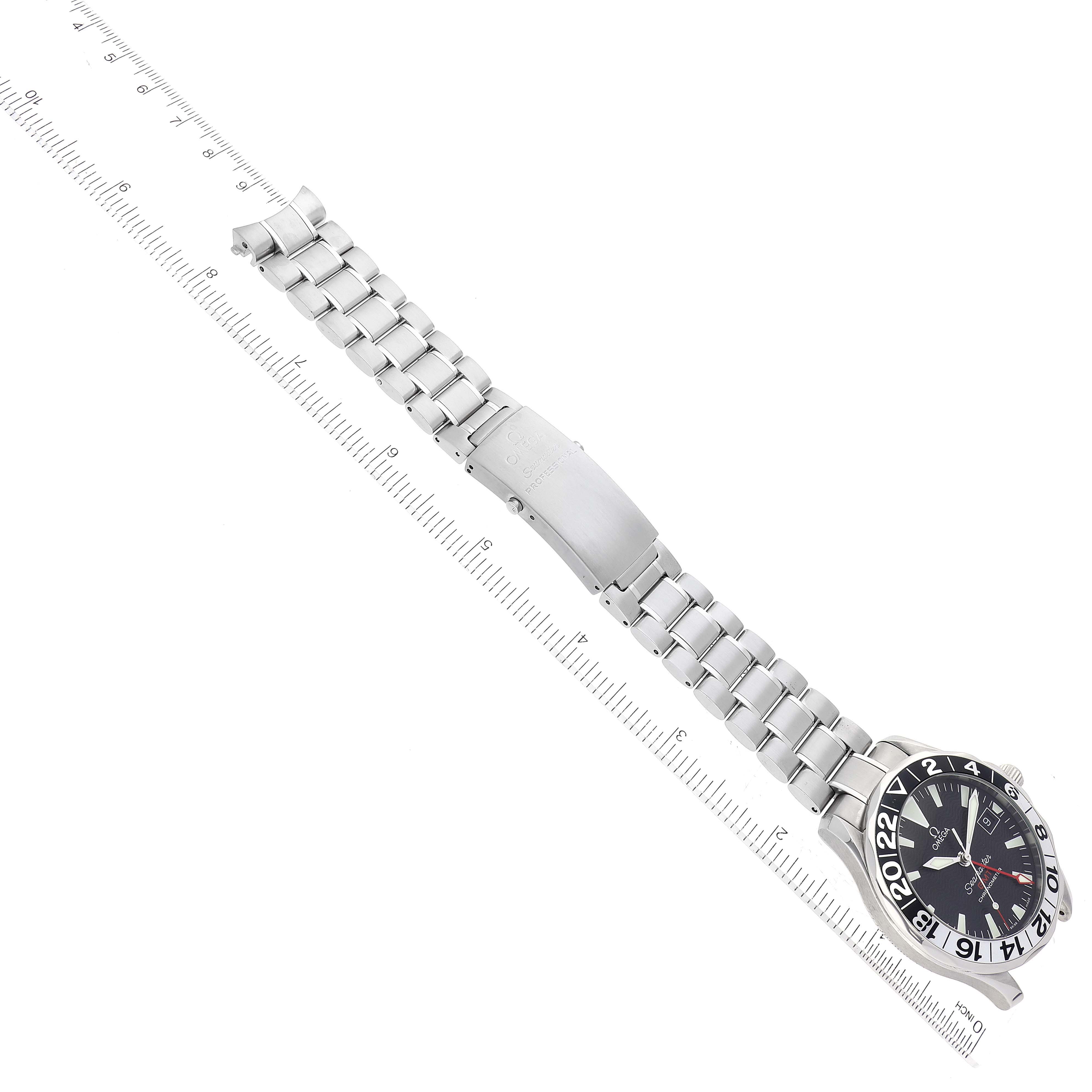 The image shows an Omega Seamaster 2234.50.00 Men
s Stainless Steel Black Dial 2234.50.00 Men
s Stainless Steel Black Dial watch laid flat, displaying its face and a metal bracelet with a clasp, viewed from the top.