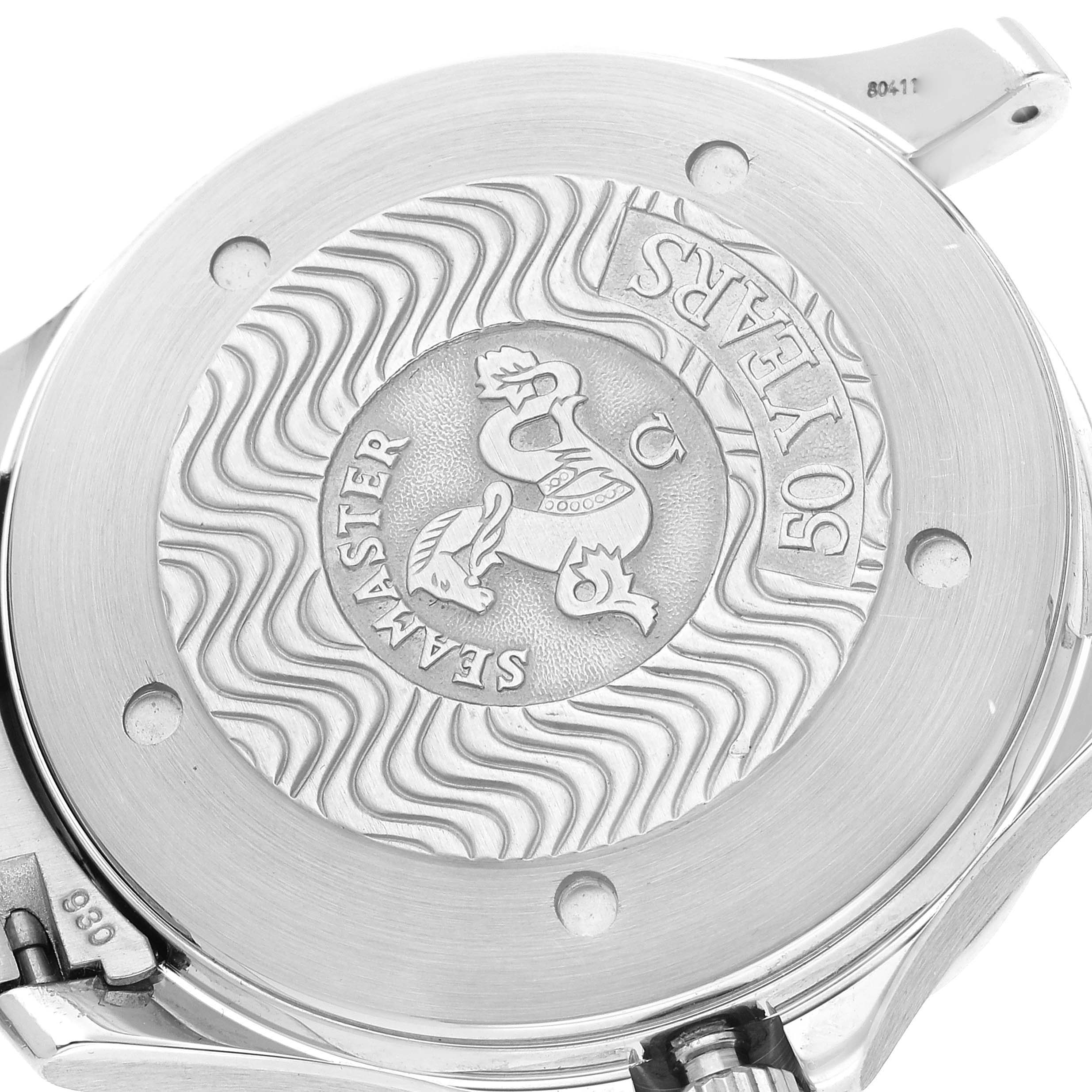 The image shows the back of an Omega Seamaster 2234.50.00 Men
s Stainless Steel Black Dial 2234.50.00 Men
s Stainless Steel Black Dial watch, highlighting its commemorative engraving and wave pattern design.