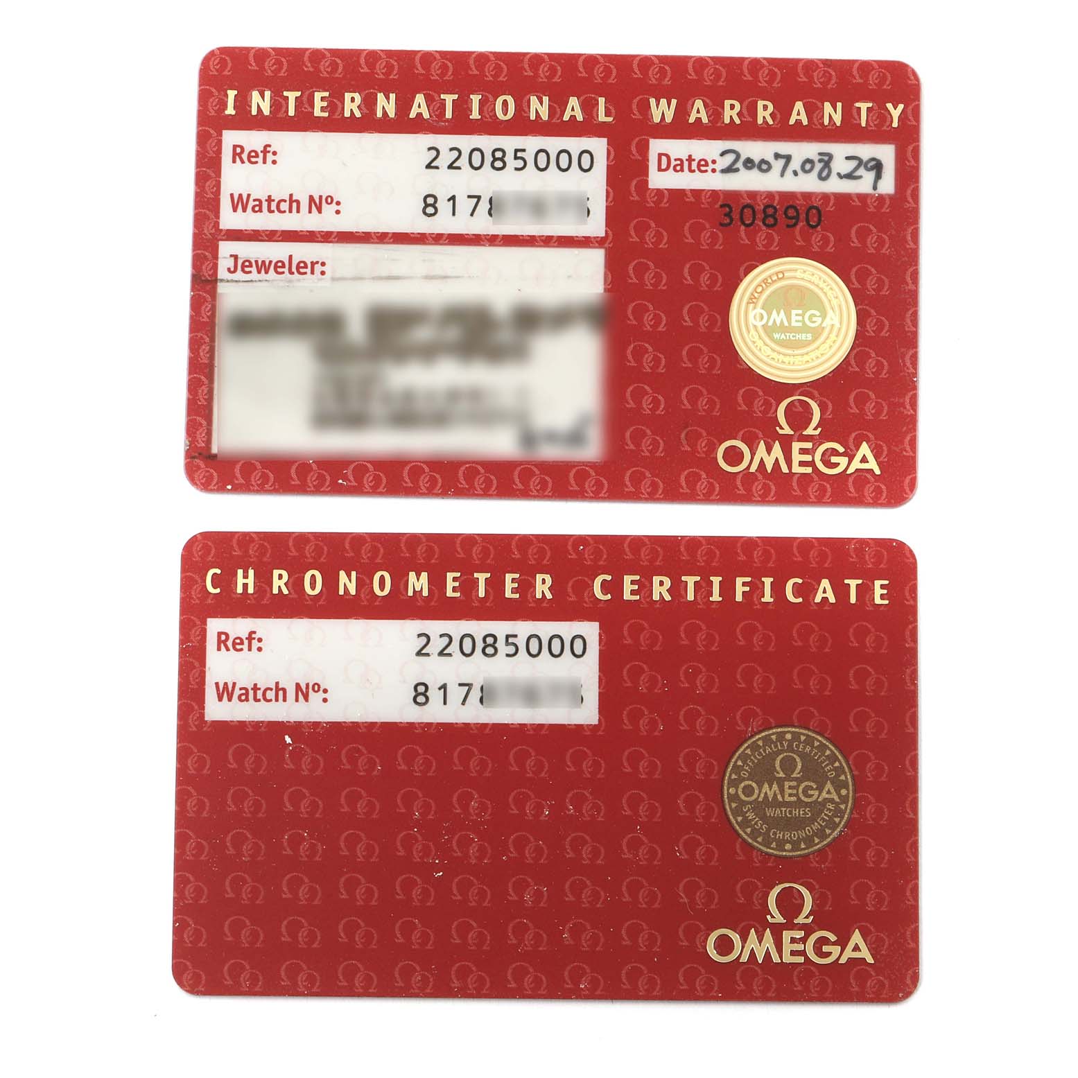 The image shows the International Warranty and Chronometer Certificate cards for an Omega Planet Ocean 2208.50.00 Men
s Stainless Steel Black Dial 2208.50.00 Men
s Stainless Steel Black Dial watch.