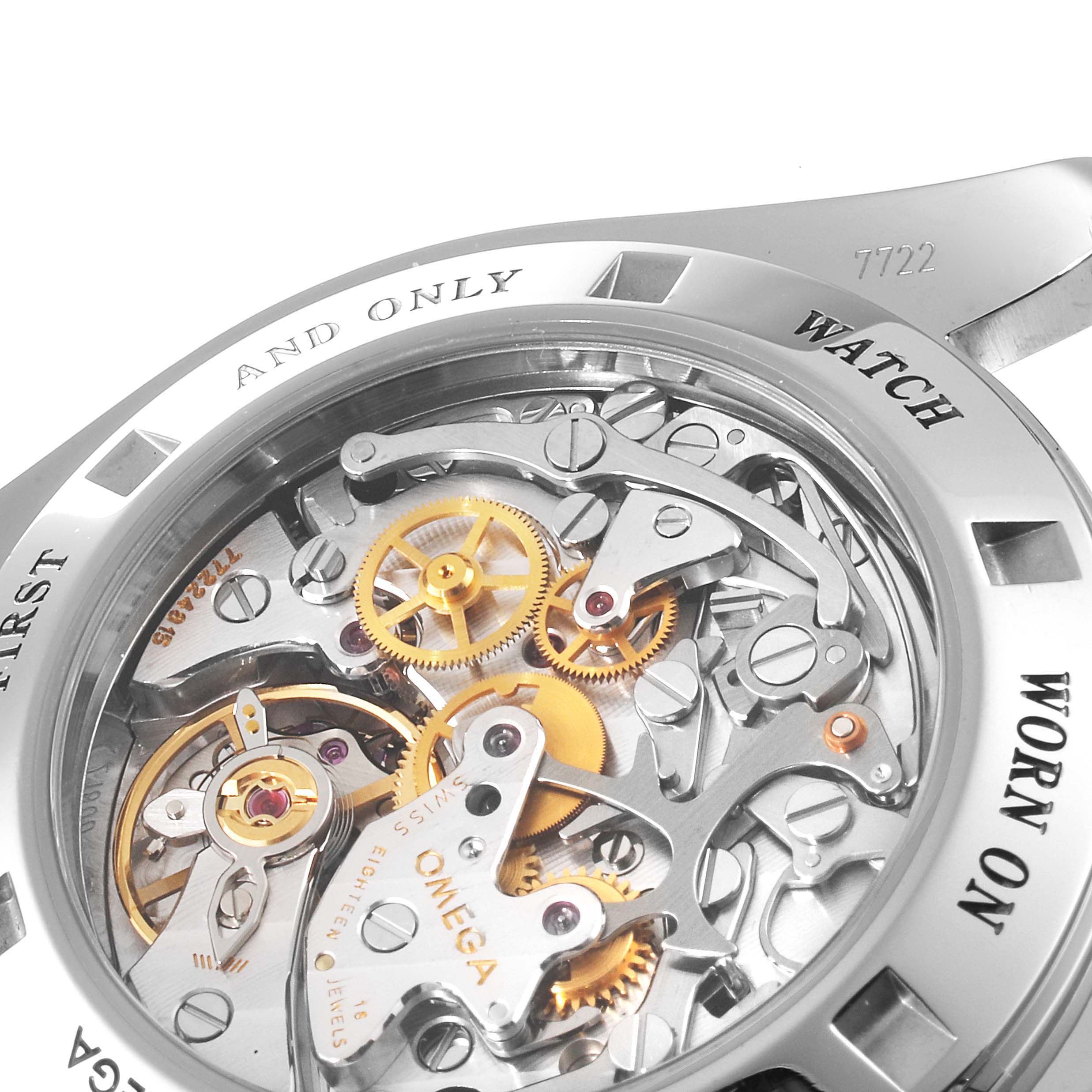 The image shows a close-up of the Omega Speedmaster 3576.50.00 Men
s Stainless Steel Black Dial 3576.50.00 Men
s Stainless Steel Black Dial
s open case back, revealing its intricate mechanical movement and gears.