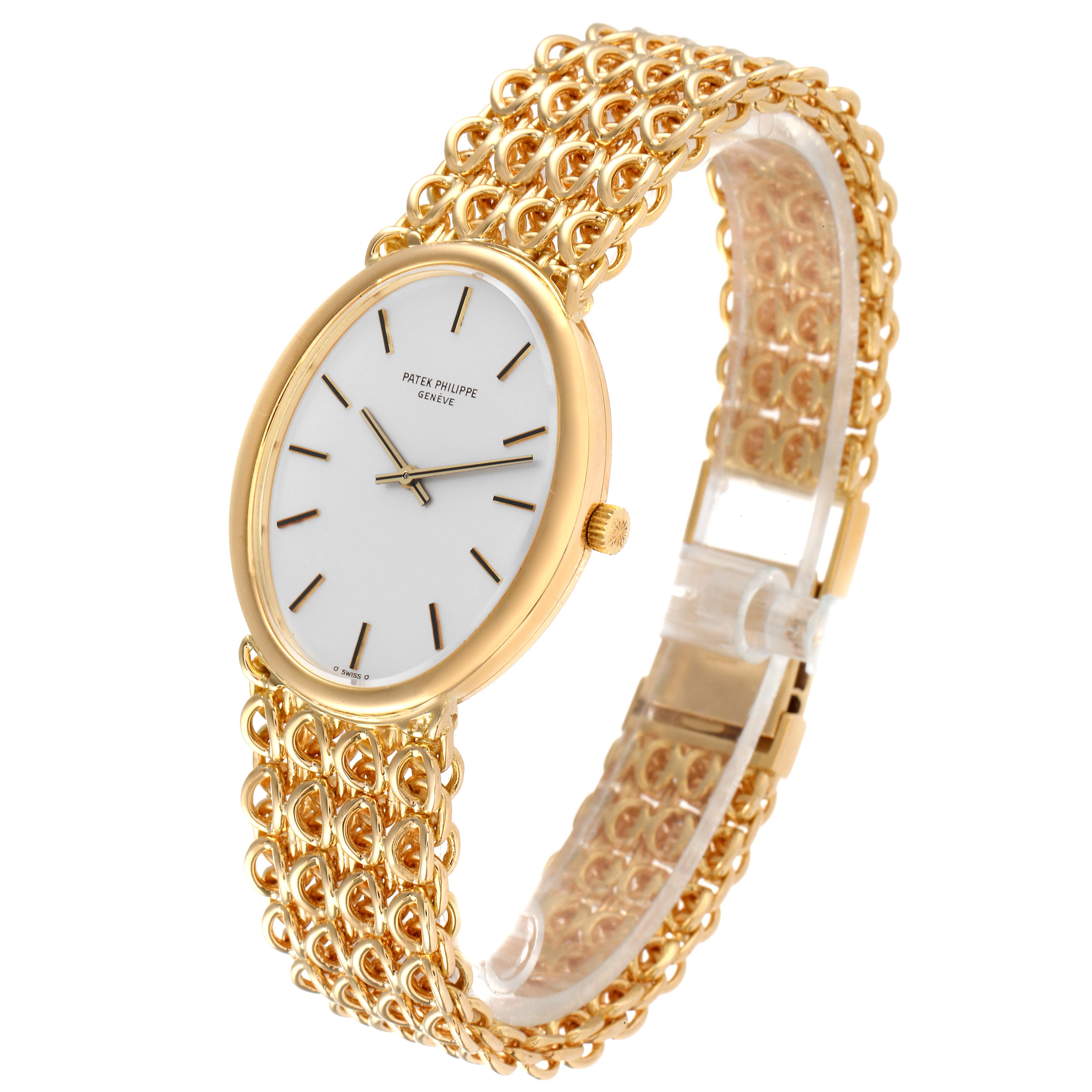 The image shows a side angle of the Patek Philippe Golden Ellipse 3598 Men's Yellow Gold Silver Dial 3598 Men's Yellow Gold Silver Dial watch, featuring its gold bracelet and white dial.