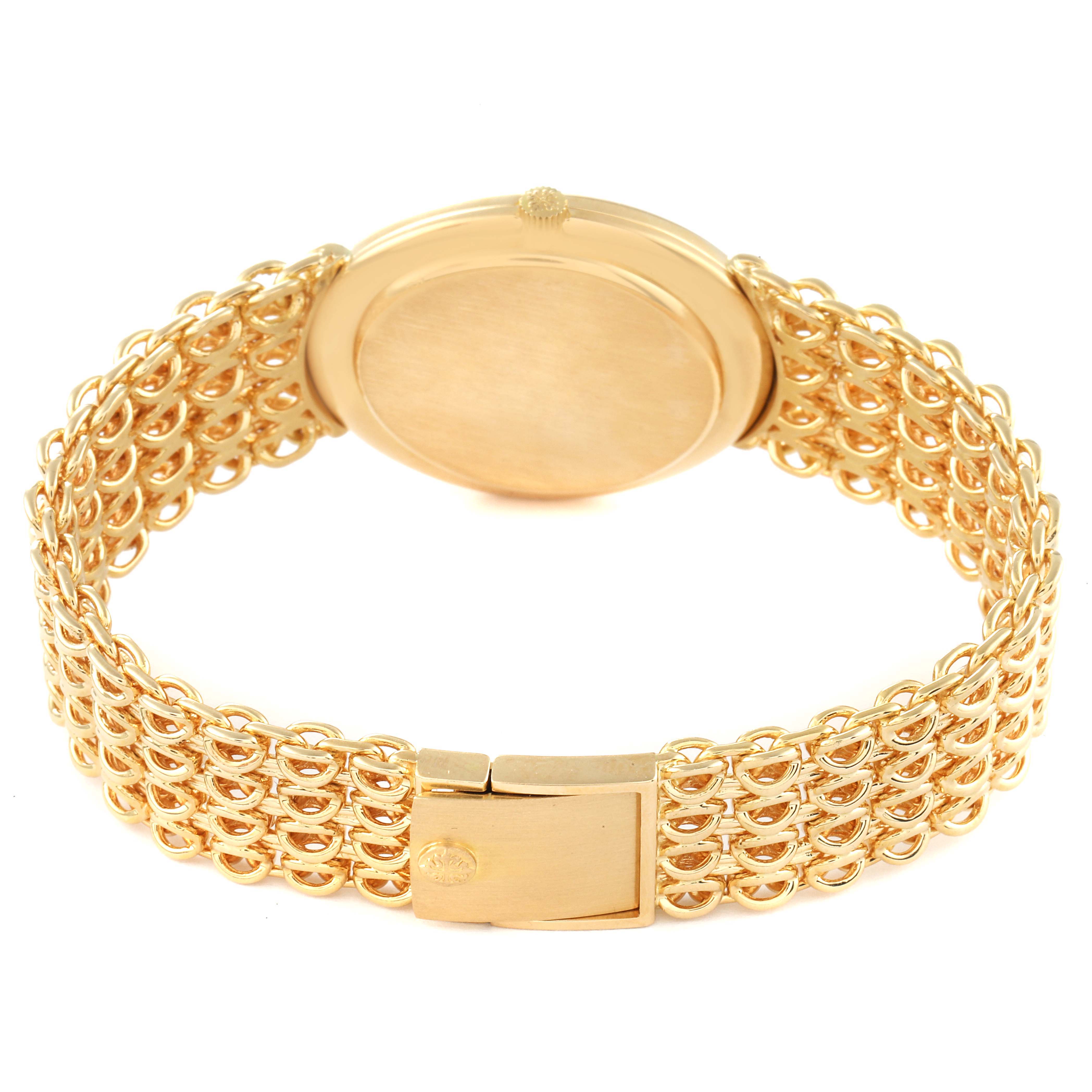 The image shows the back and clasp of a Patek Philippe Golden Ellipse 3598 Men's Yellow Gold Silver Dial 3598 Men's Yellow Gold Silver Dial watch, highlighting the gold bracelet design.