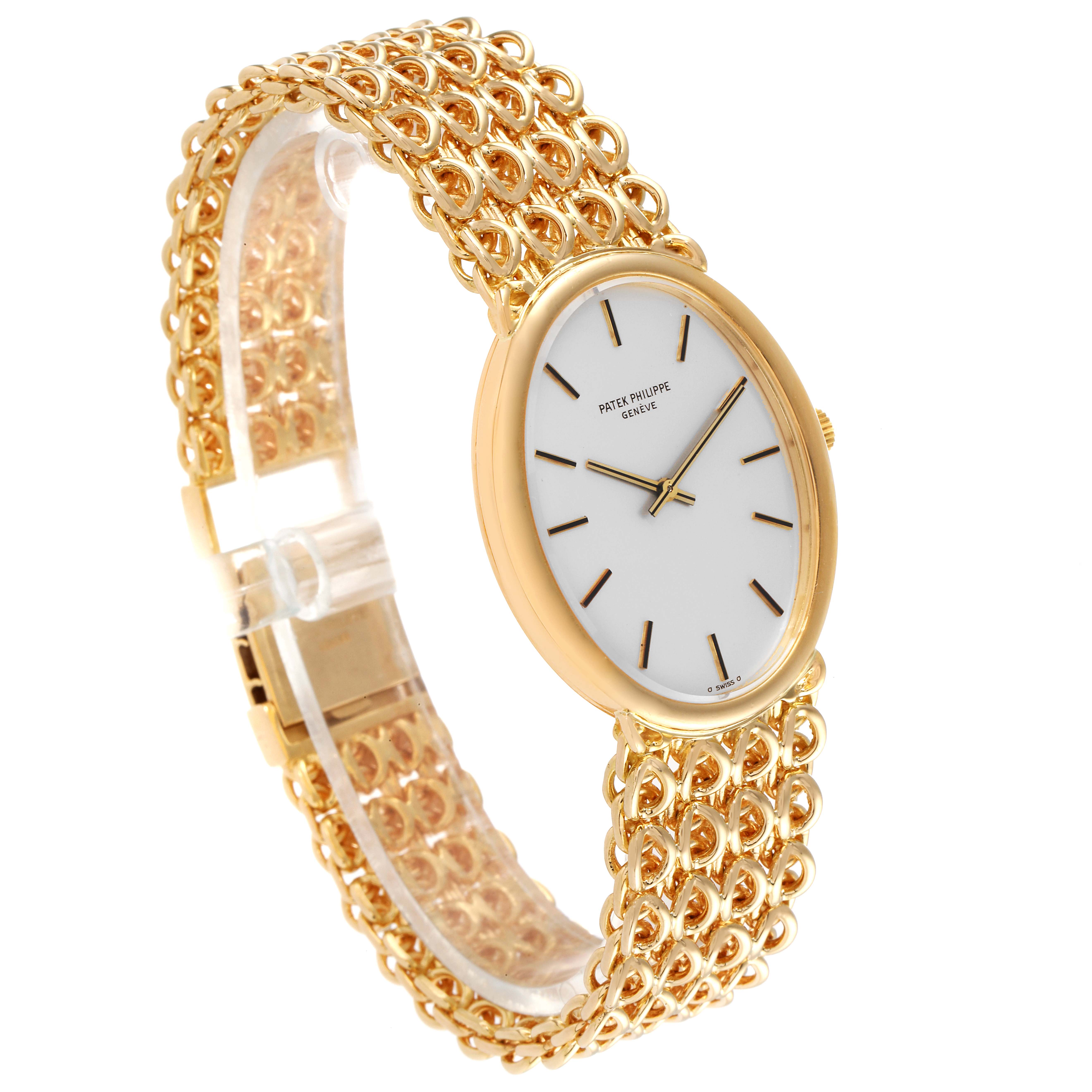 This side-angle view shows the face and gold link bracelet of the Patek Philippe Golden Ellipse 3598 Men's Yellow Gold Silver Dial 3598 Men's Yellow Gold Silver Dial watch.