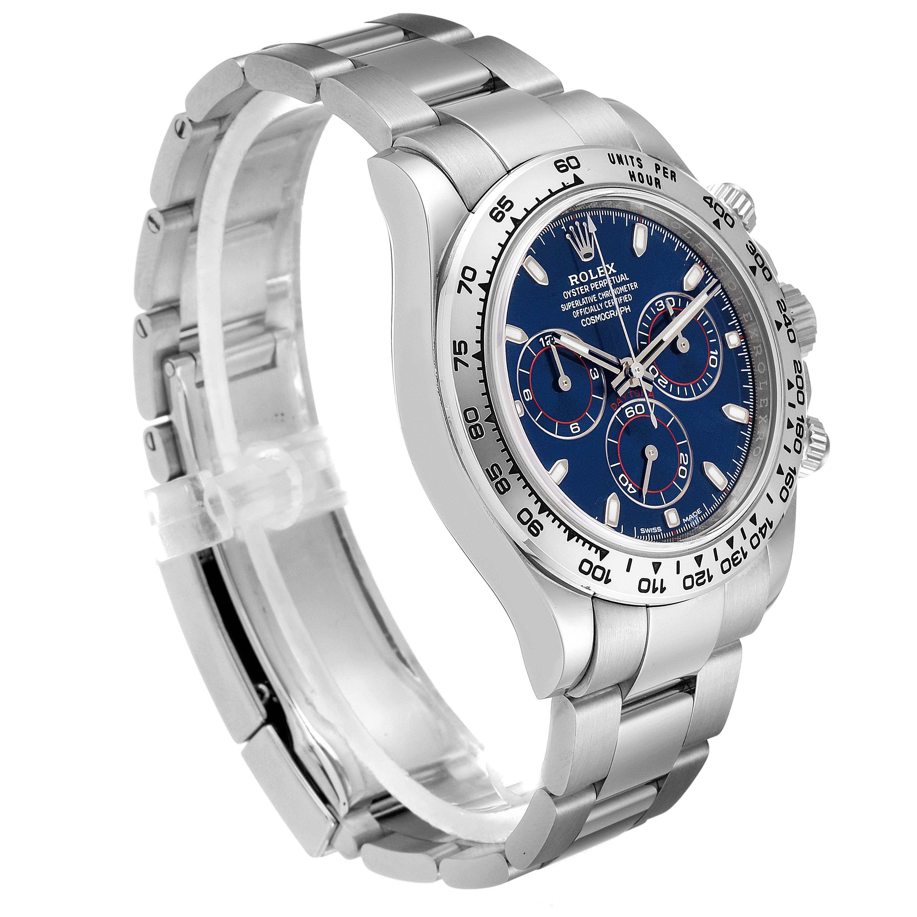 The Rolex Daytona 116509 Men's White Gold Blue Dial 116509 Men's White Gold Blue Dial watch is shown at a three-quarter angle, displaying its blue dial, chronograph functions, and stainless steel bracelet.