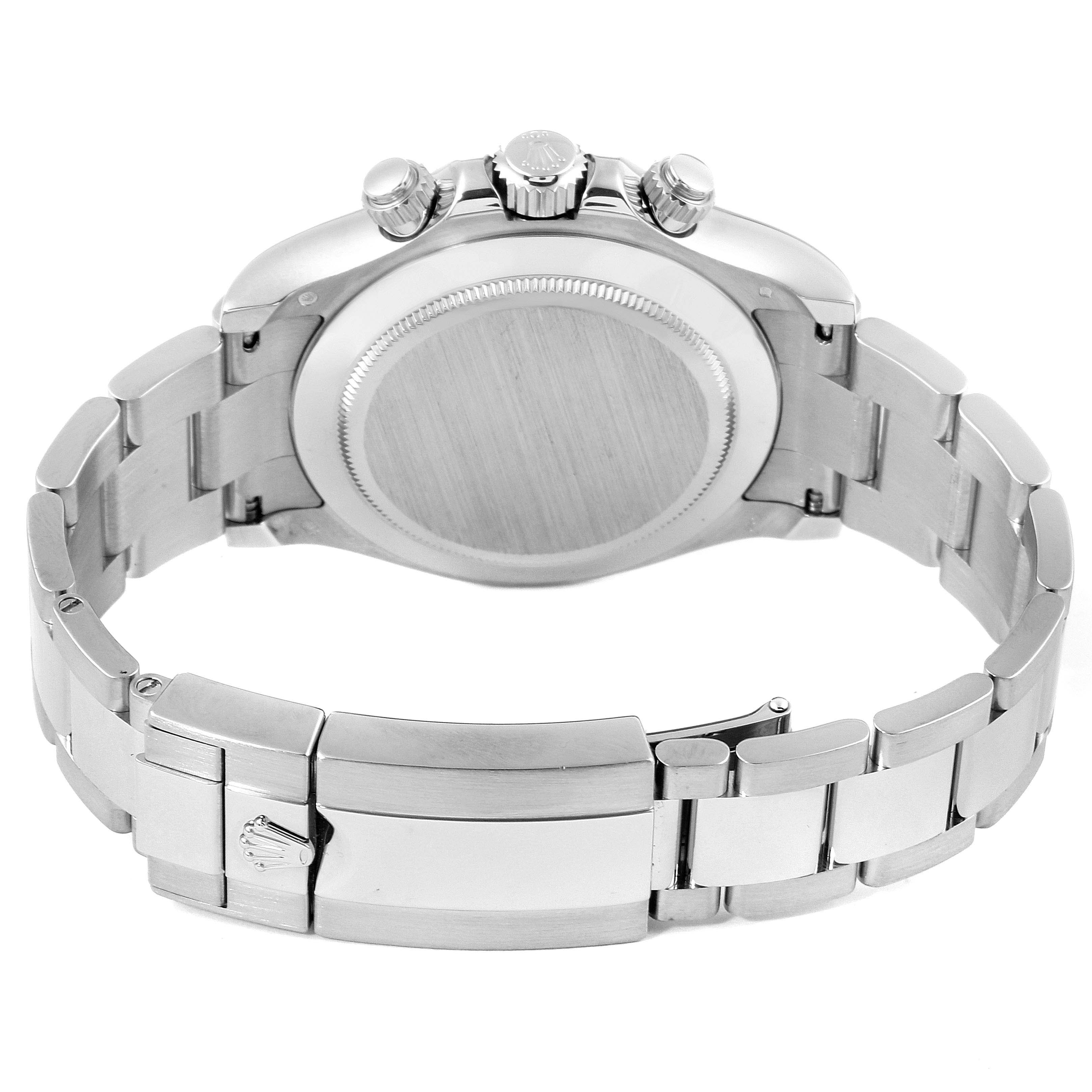 The image shows the back case, crown, and part of the bracelet of a Rolex Daytona 116509 Men's White Gold Blue Dial 116509 Men's White Gold Blue Dial watch from a rear angle.