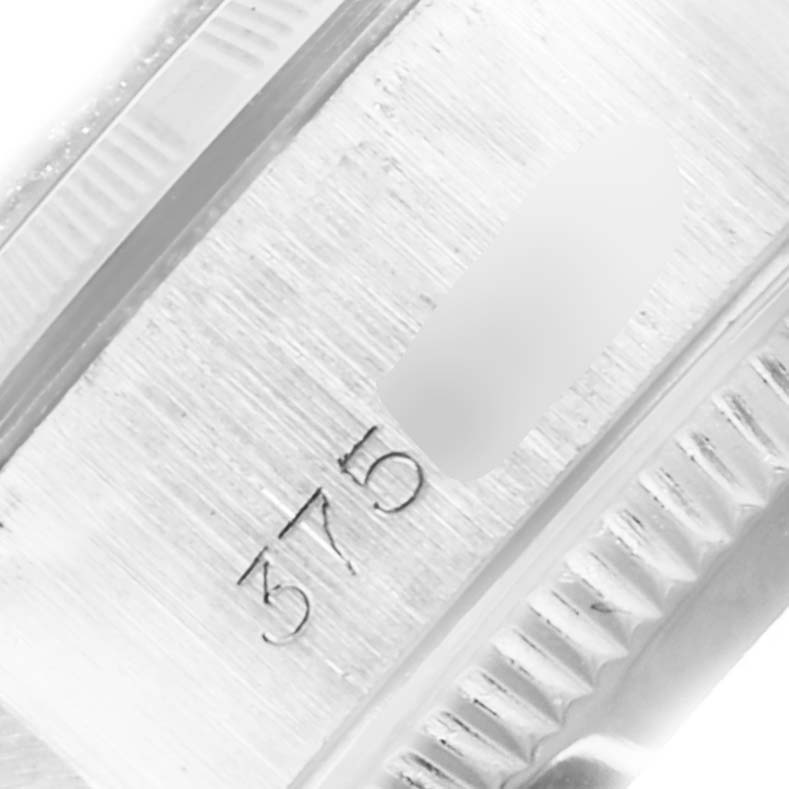 This close-up image shows the inner part of the bezel and part of the case with the model number of a Rolex Date 6919 Women
s Stainless Steel Silver Dial 6919 Women
s Stainless Steel Silver Dial watch.