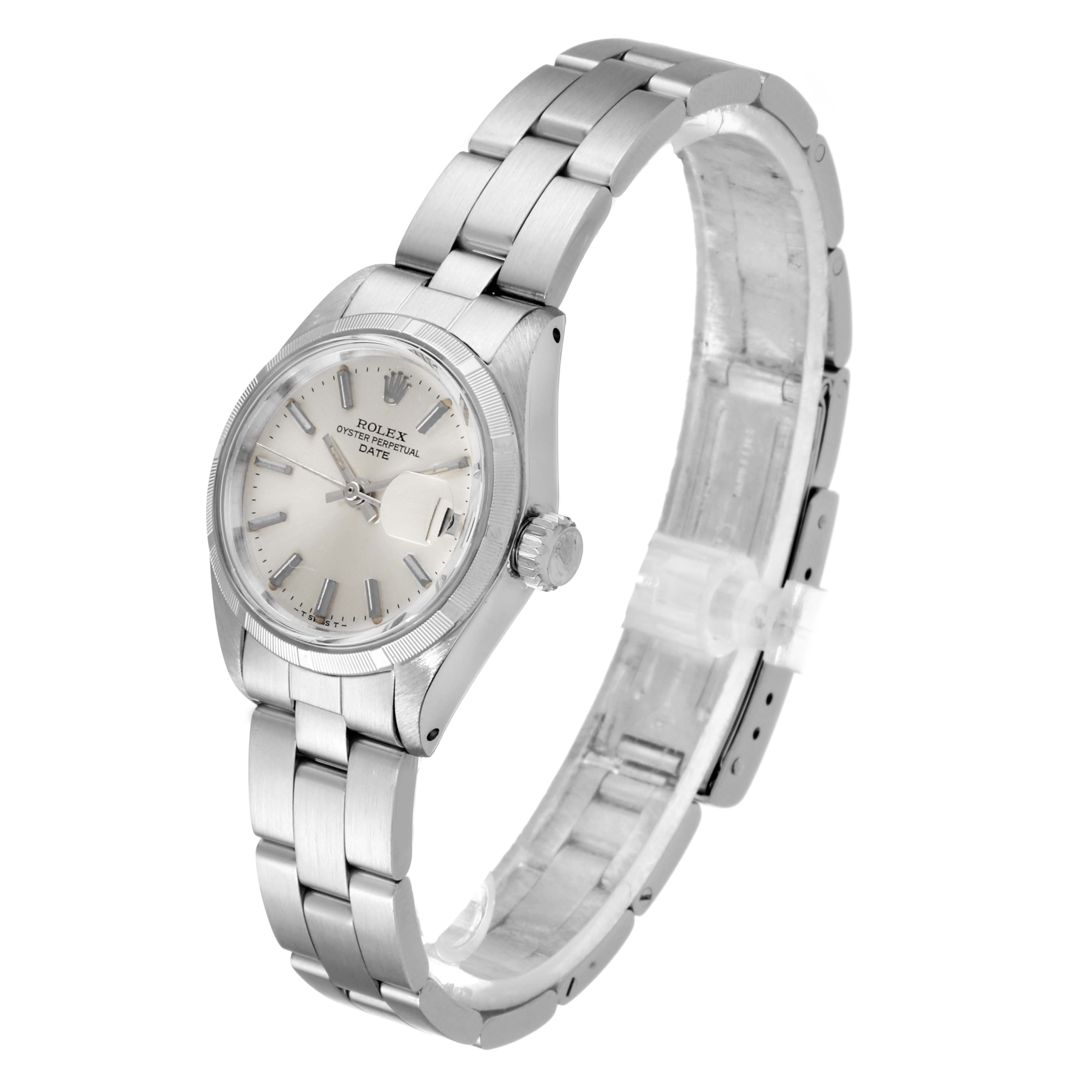 The image shows a Rolex Date 6919 Women
s Stainless Steel Silver Dial 6919 Women
s Stainless Steel Silver Dial model watch angled to display the face, bezel, crown, and bracelet.