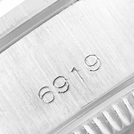 The image shows the model number "6919" engraved on the case of a Rolex Date 6919 Women
s Stainless Steel Silver Dial 6919 Women
s Stainless Steel Silver Dial watch.