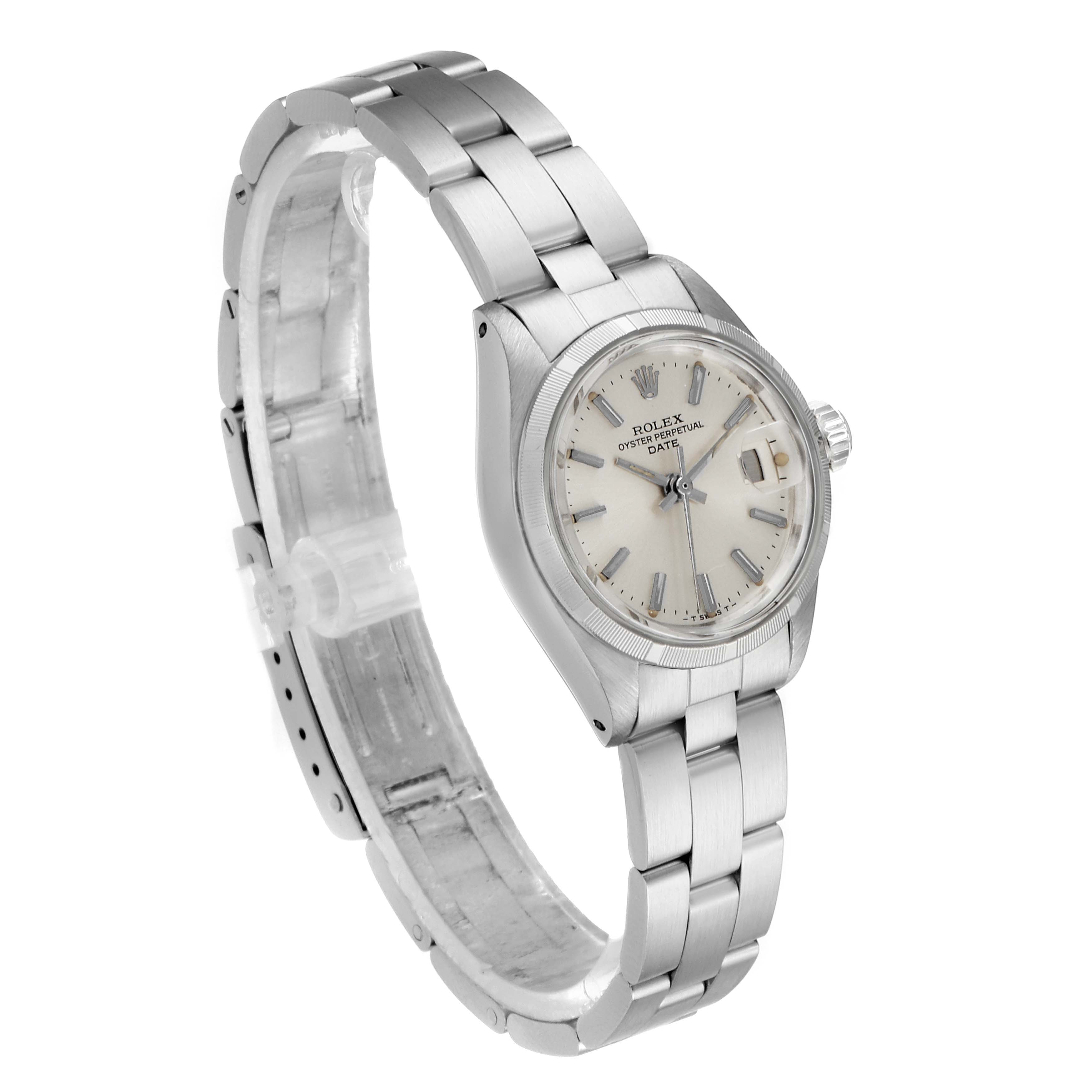 The Rolex Date 6919 Women
s Stainless Steel Silver Dial 6919 Women
s Stainless Steel Silver Dial watch is shown at a three-quarter angle, displaying the bracelet, crown, dial, and case.