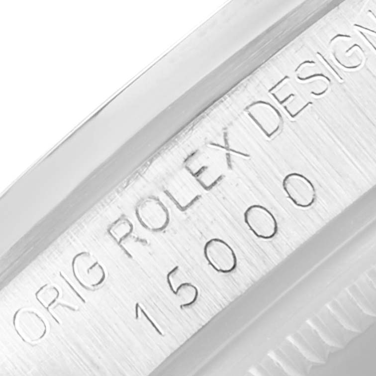 This image shows the side case engraving of a Rolex Date 15000 Men's Stainless Steel Silver Dial 15000 Men's Stainless Steel Silver Dial model, highlighting the serial number and "ORIG ROLEX DESIGN."