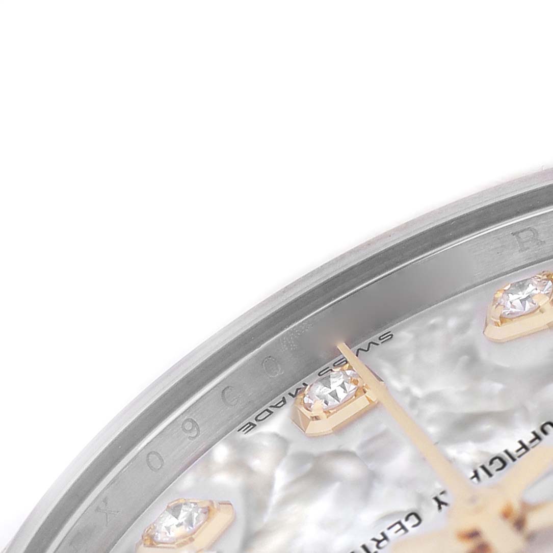 The image shows a close-up of the Rolex Mid-Size 278383RBR Women's Steel and Gold (two tone) Mother of Pearl Dial watch dial with diamond hour markers and part of the bezel.
