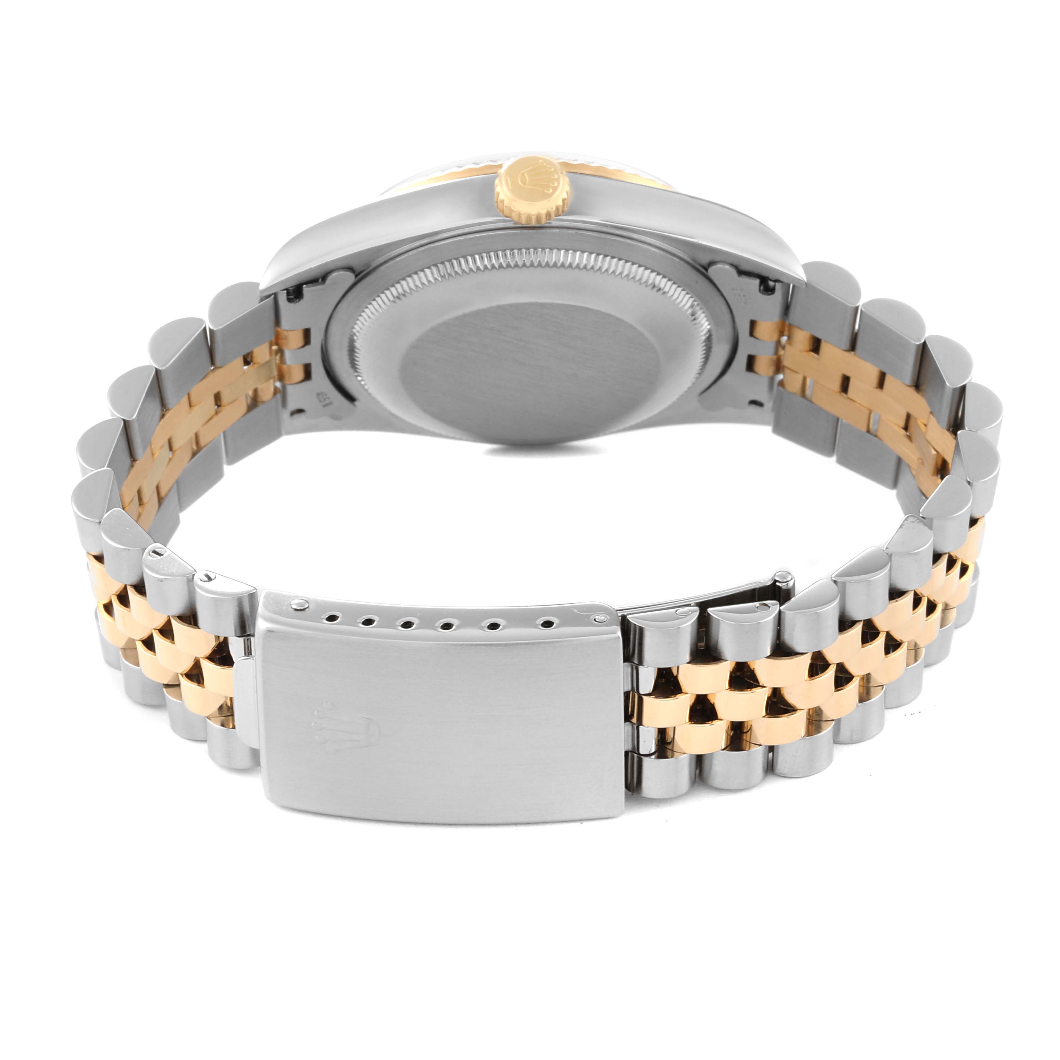 The image shows the back view of a Rolex Datejust 16233 Men's Steel and Gold (two tone) Black Dial 16233 Men's Steel and Gold (two tone) Black Dial watch, displaying its clasp, bracelet, and caseback.