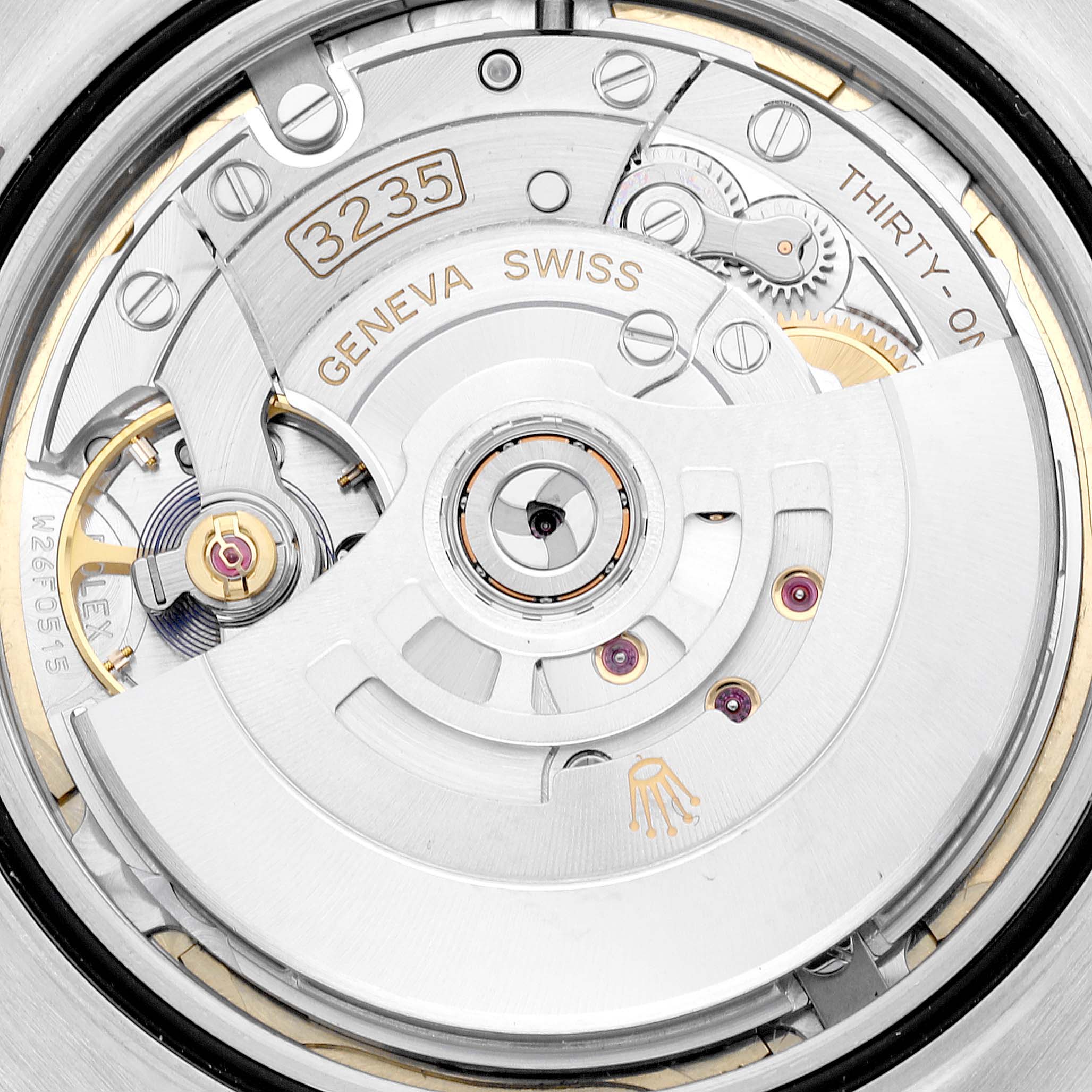 This is a close-up of the movement mechanism of a Rolex Datejust 41 126333 Men's Steel and Gold (two tone) Champagne Dial 126333 Men's Steel and Gold (two tone) Champagne Dial watch, showing intricate internal components.