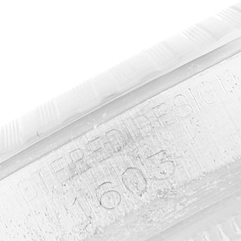This image shows a close-up of the engraved model number "1603" on the side of the case of a Rolex Vintage Collection 1603 Men
s Stainless Steel Silver Dial 1603 Men
s Stainless Steel Silver Dial watch.