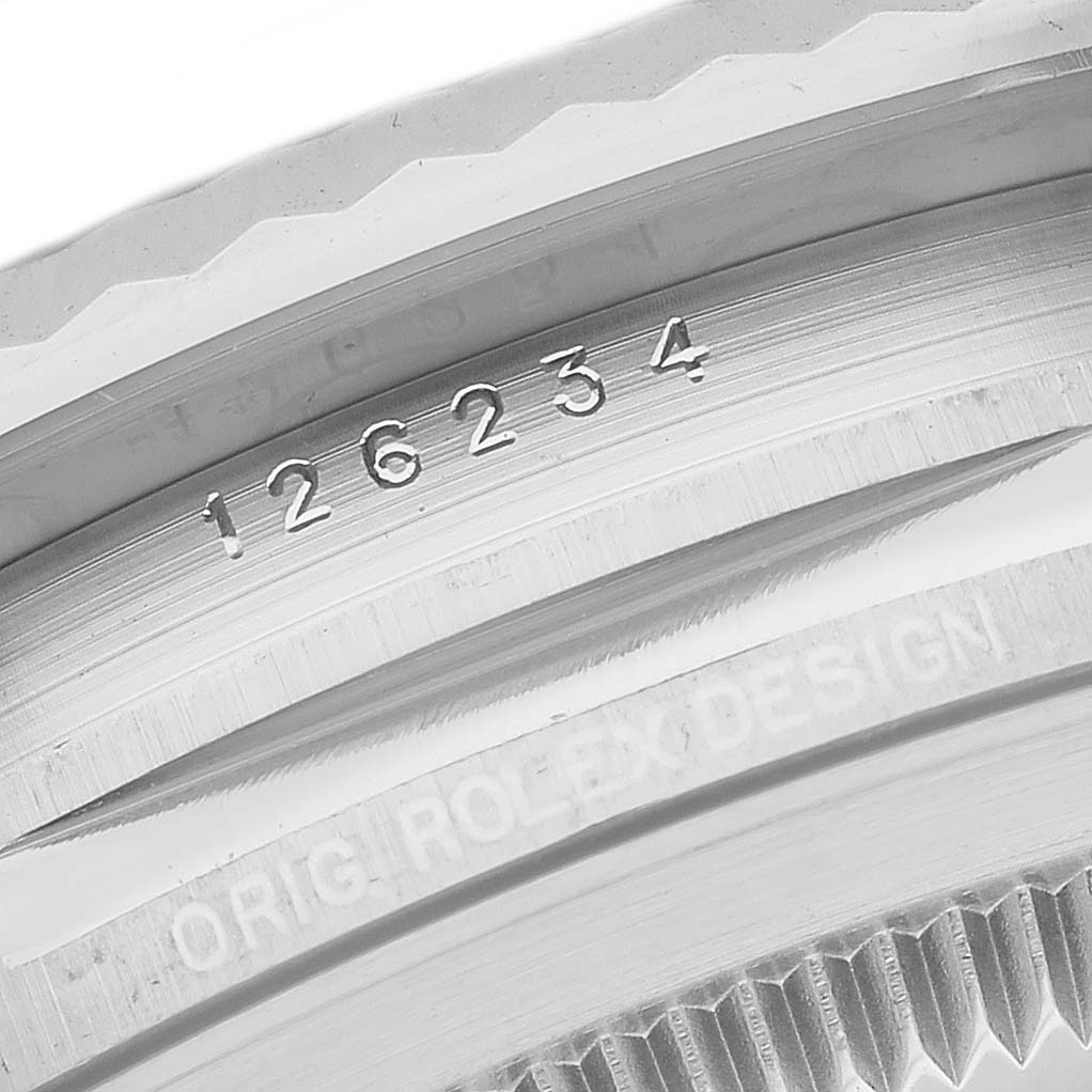 This image shows a close-up of the bezel and model number engraving on a Rolex Datejust 126234 Men's Stainless Steel Purple Dial 126234 Men's Stainless Steel Purple Dial watch.