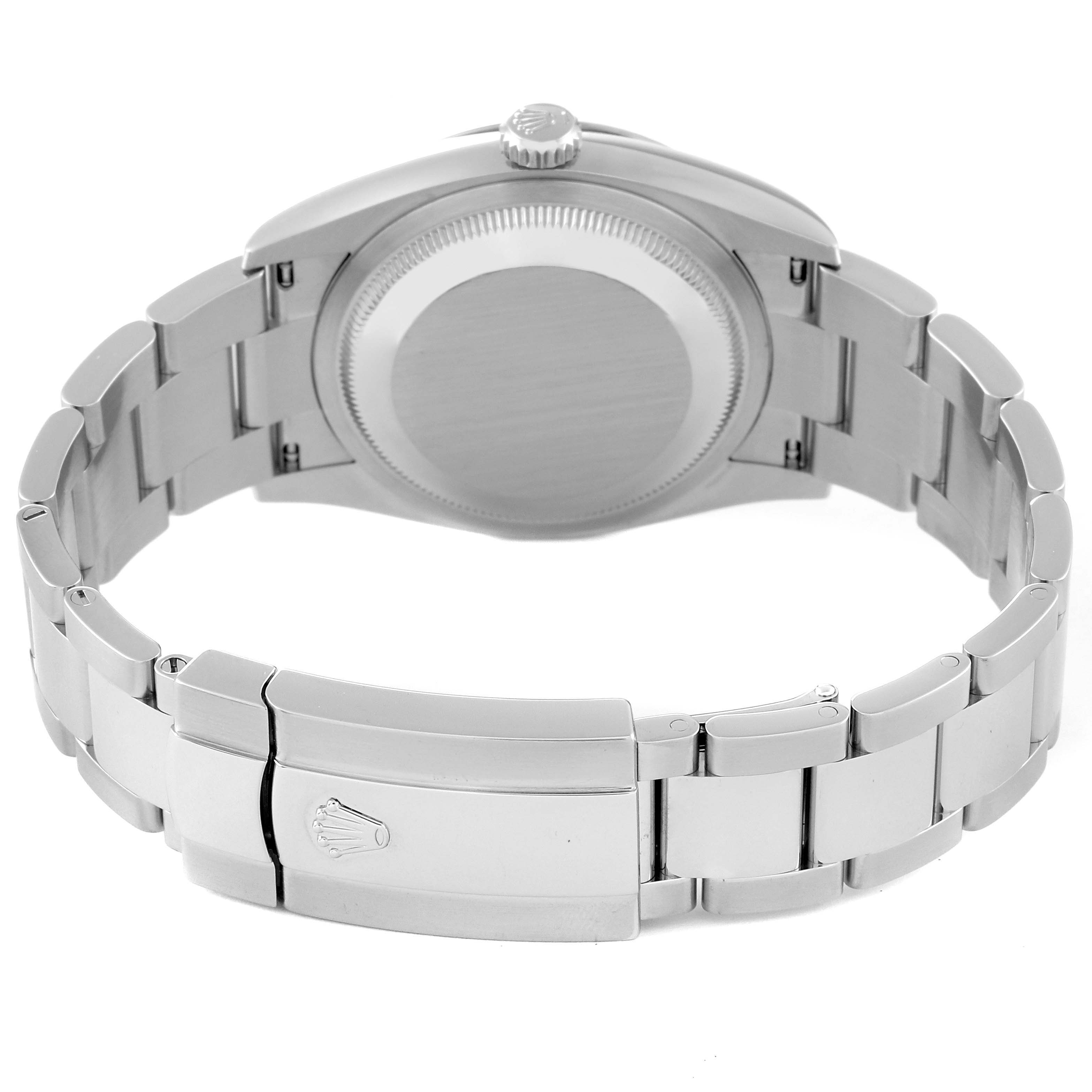 The image shows the back view of a Rolex Datejust 126234 Men's Stainless Steel Purple Dial 126234 Men's Stainless Steel Purple Dial watch, highlighting the case back, crown, and bracelet with the clasp.