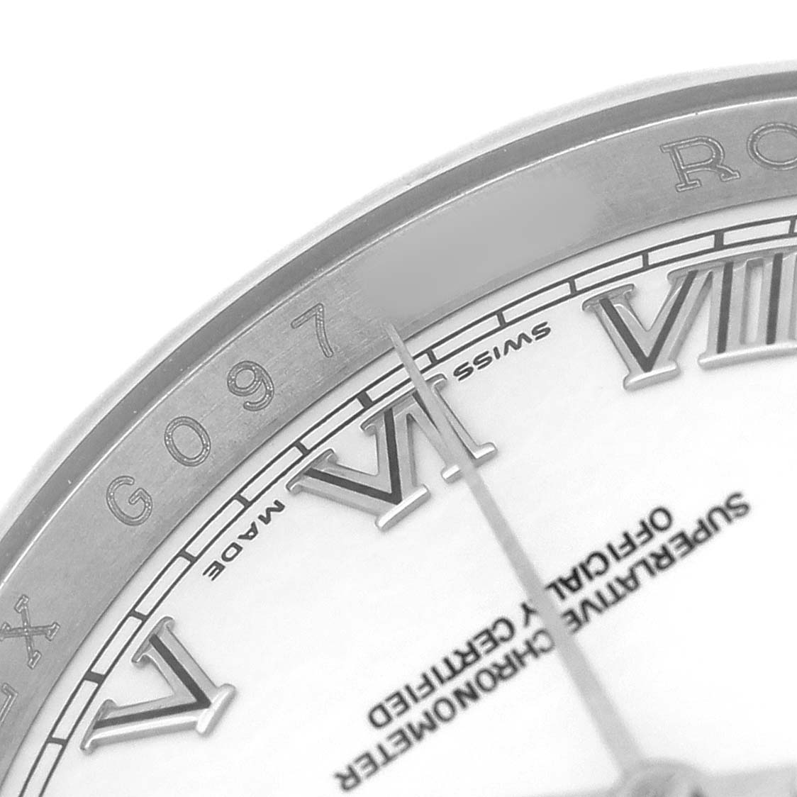 The image shows a close-up of the dial and bezel of a Rolex Datejust 116200 Men's Stainless Steel White Dial watch, featuring Roman numerals and part of the serial number.