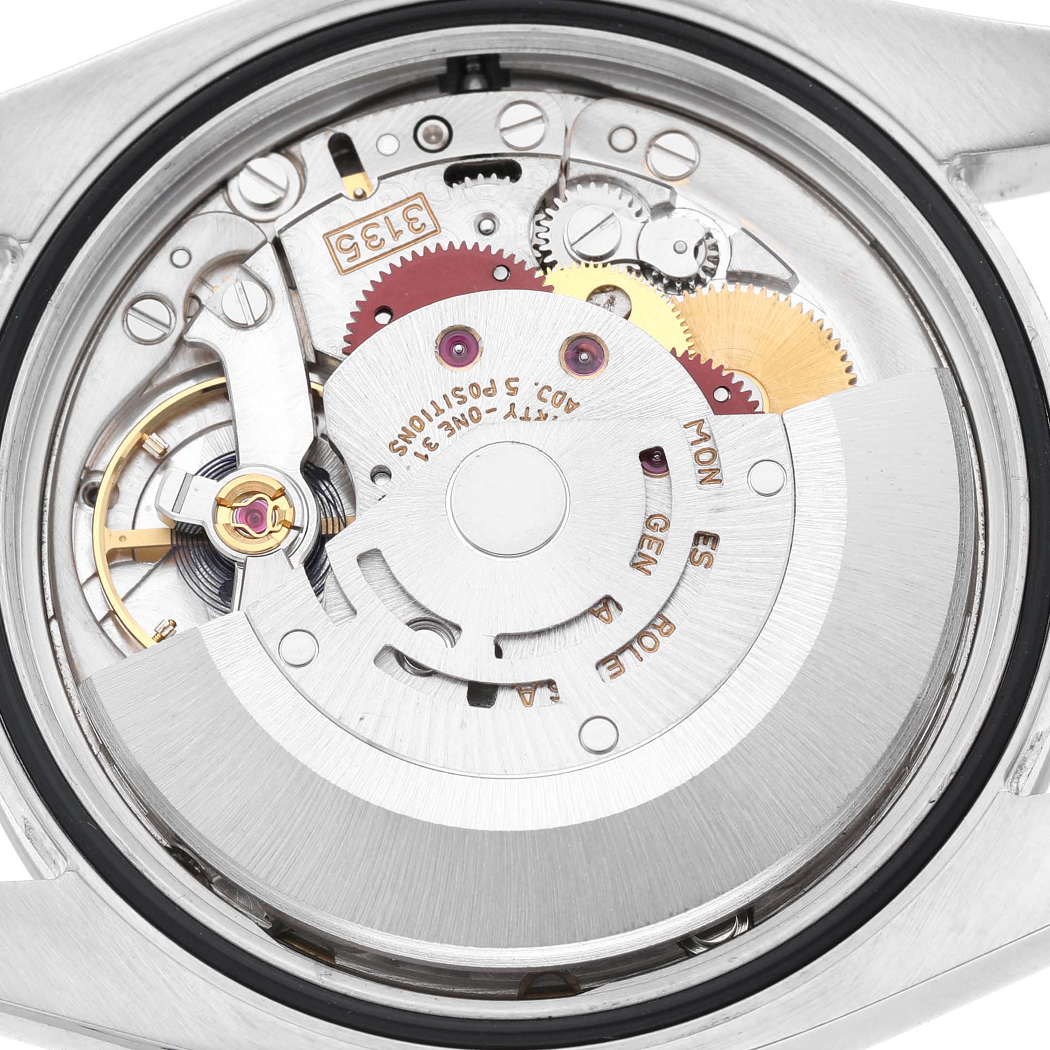 The image shows the movement mechanism of a Rolex Datejust 116200 Men's Stainless Steel White Dial watch from a back view.